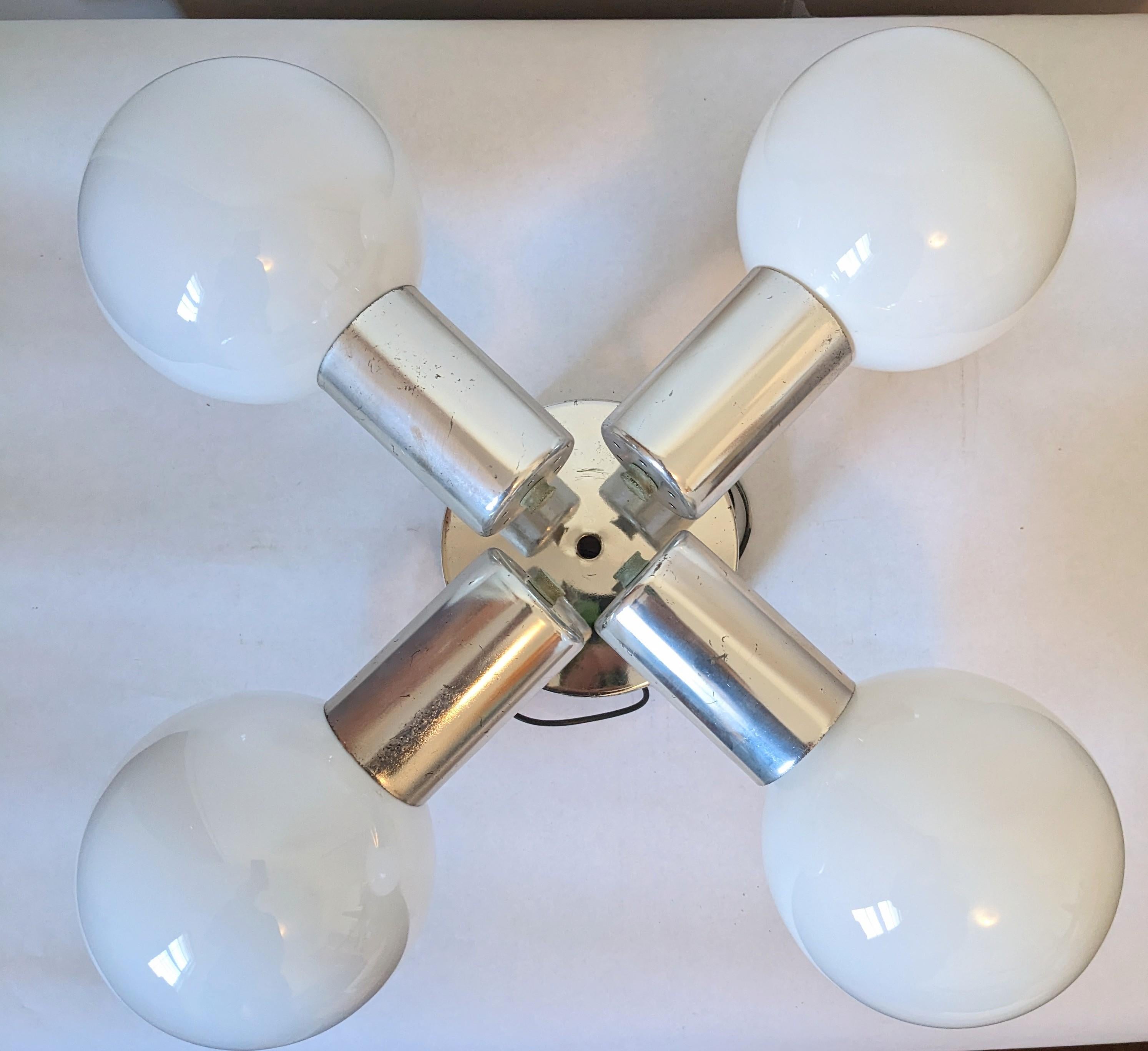 Mod Chrome Globe Ceiling Fixture from the 1970s. 4 frosted globe bulbs are mounted onto a chrome flush mount fixture. 1970s USA. 