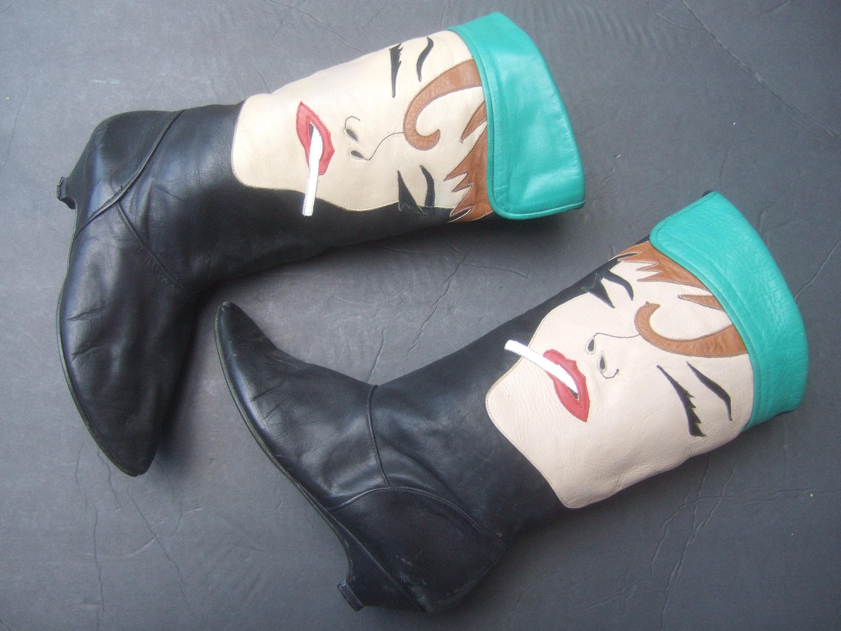 Edgy mod pop art leather boots designed by Zalo c 1980s
The unique avant-garde leather boots are constructed with flesh tone
leather panels depicting a woman's face on each exterior
side of each boot

The chic woman is smoking a cigarette protruding
