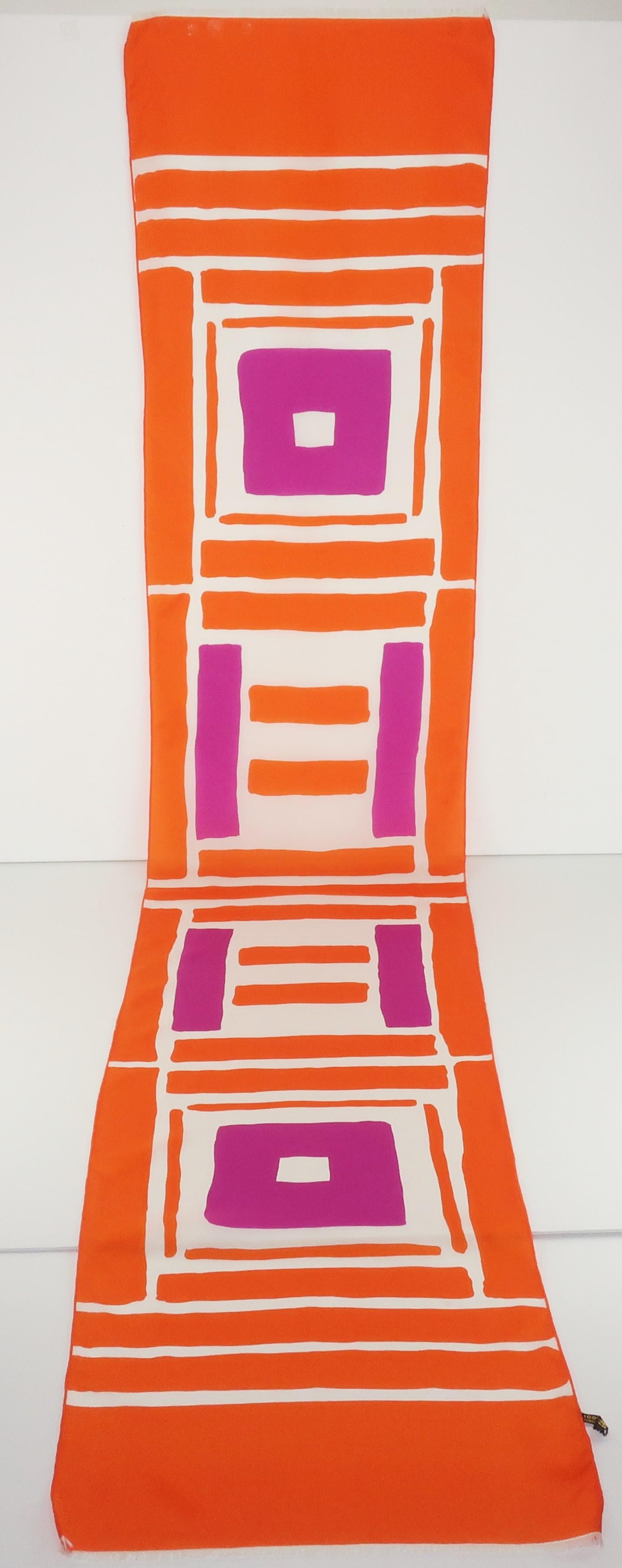 The bold geometric pattern paired with the color combination of orange, purple and white gives this French silk scarf a period perfect mod look.  The skinny long silhouette is ideal for sashing, draping and wrapping.  Marked ‘Made in France’ without