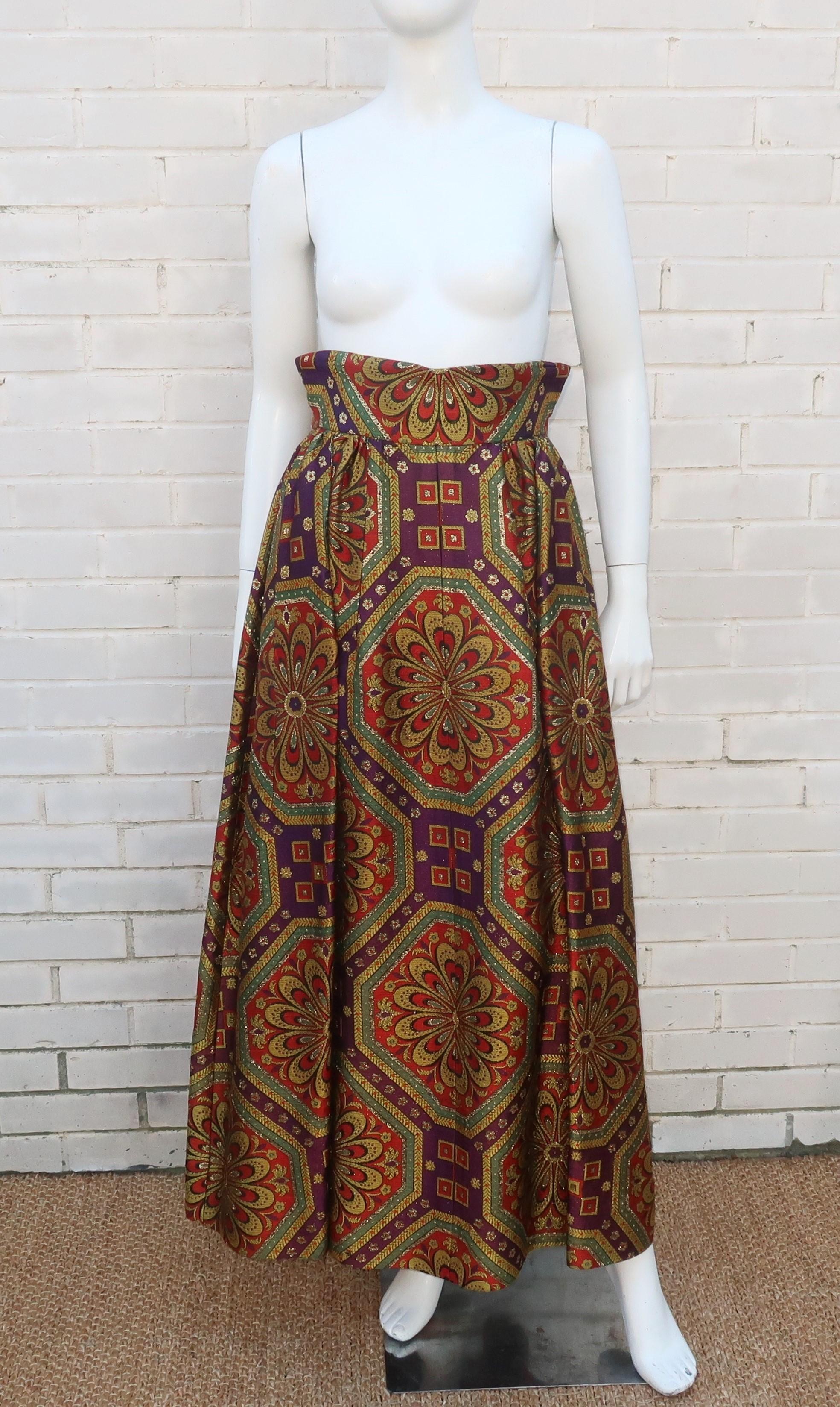 1960's heavy brocade skirt in a maxi length with a high waist.  The skirt zips at the back and has hidden front pockets.  The glamorous brocade is designed in shades of gold, purple, red and army green with gold lame metallic threading.  The fabric