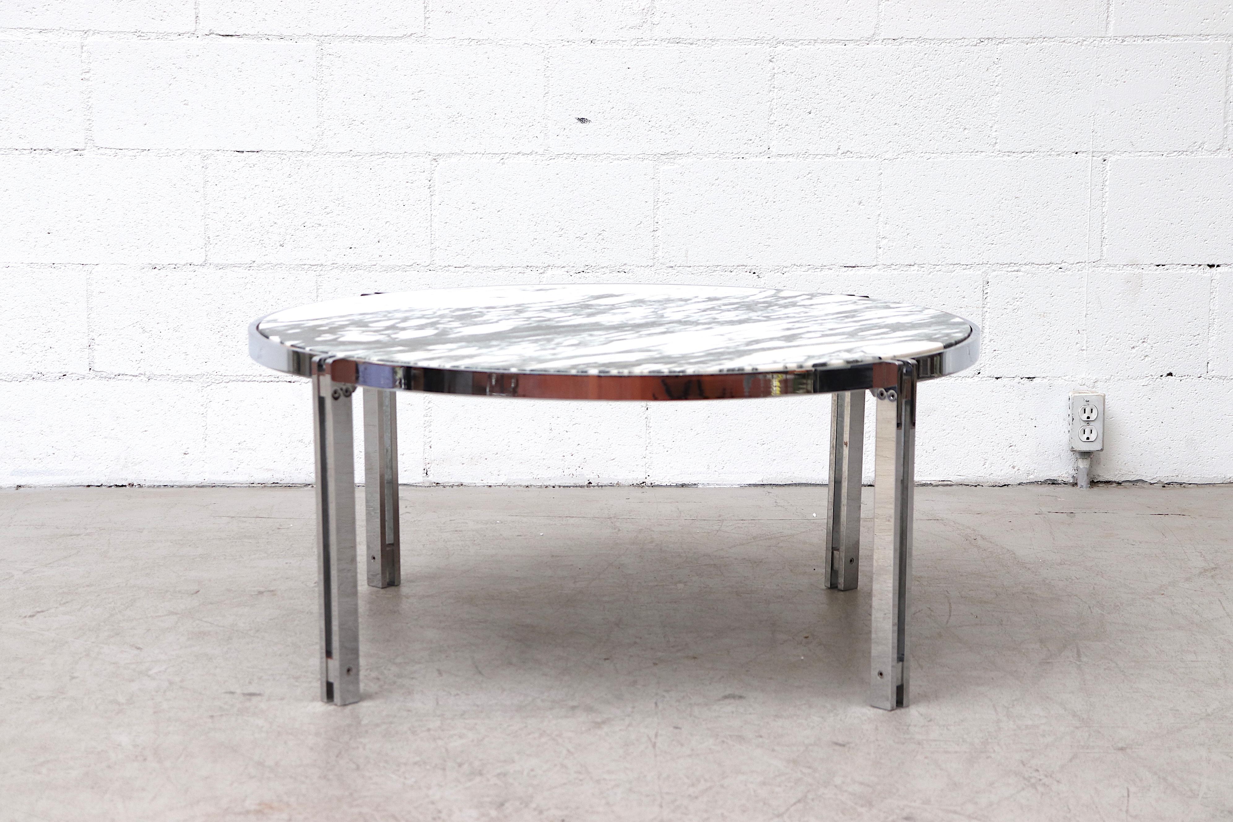 Mid-Century Modern high polished chrome coffee or side table with beautiful veined inset marble top. In original condition with some wear and scratching to both Frame and Top.