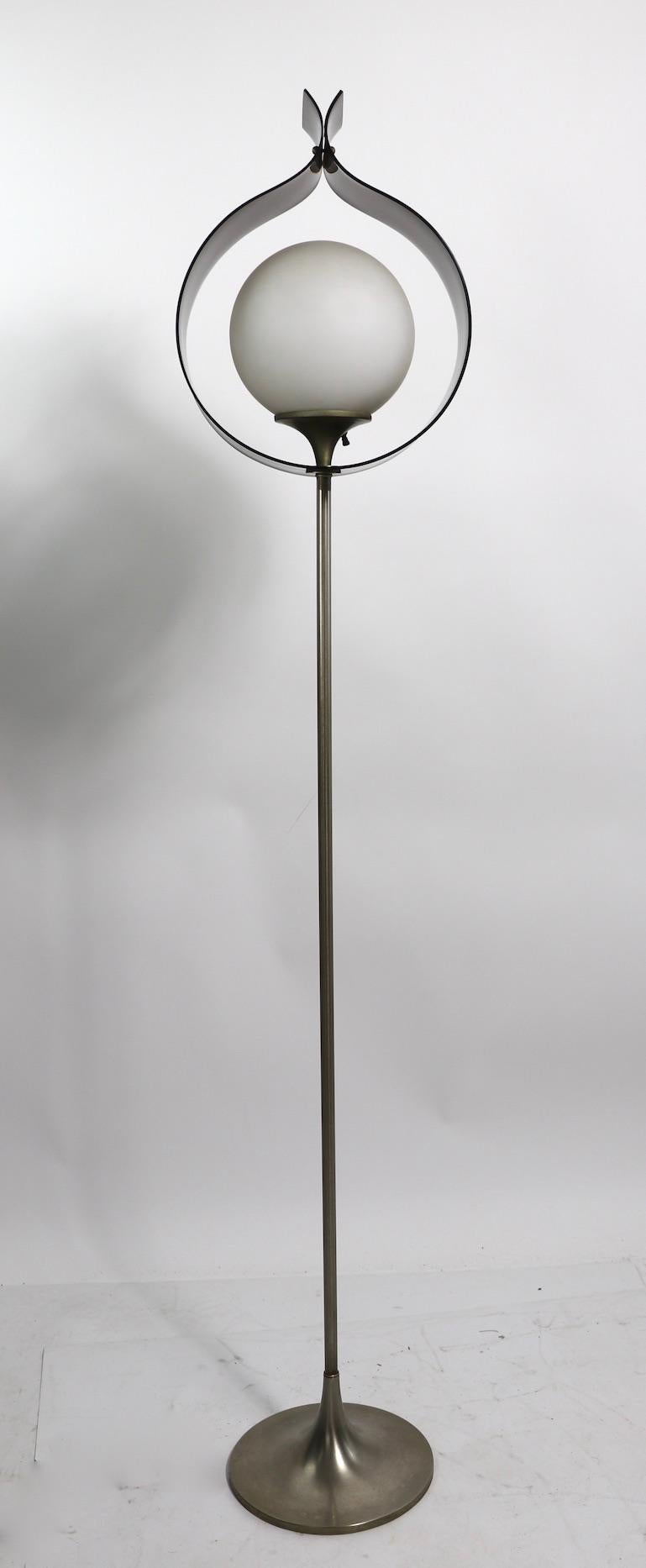 Rare mid century mod floor lamp having tinted acrylic tulip form shades which surround a frosted glass ball globe shade, on elegant elongated vertical base. This example is in very fine, original, clean and working condition. We have had many Laurel