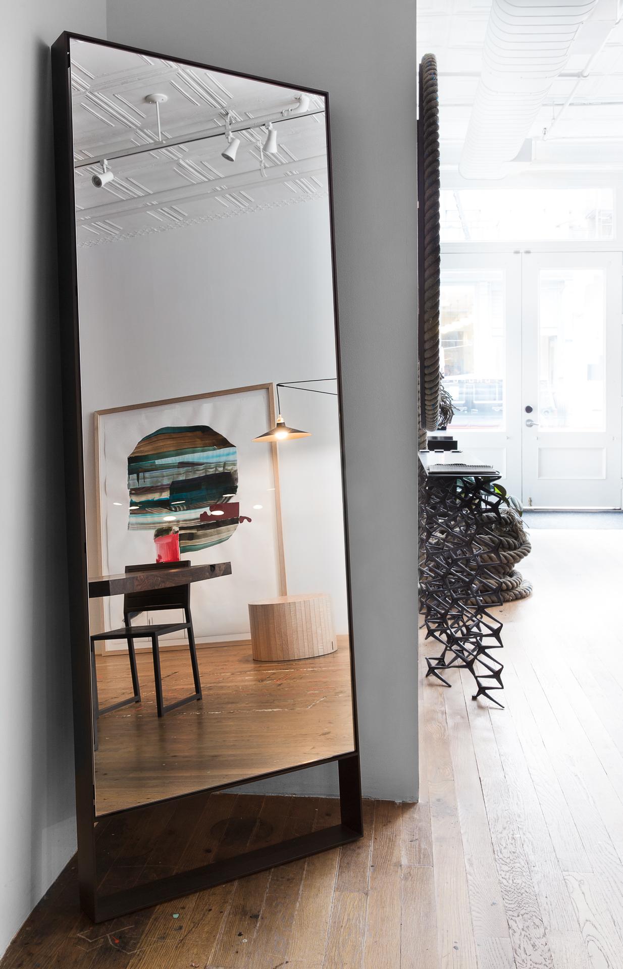 Bold proportions, striking angles, and an elevated steel frame make the floor-length Mod Mirror a stunning complement to any room, hall or entryway.