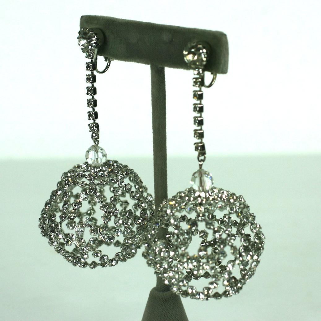 Cool Mod Pave Heart Globe Earrings from the 1960's. Cages of pave hearts make up the globes which are suspended from rhinestone chains. A large central paste clips on at the ear. 
Clip back fittings.
3.5