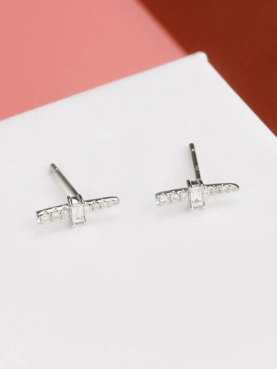 Beautiful combination of micro pave and baguette diamond earrings, all with a high polish finish. Available in 18K White Gold.

Earring Information
Diamond Type : Natural Diamond
Metal : 18K
Metal Color : White Gold
Diamond Carat Weight :
