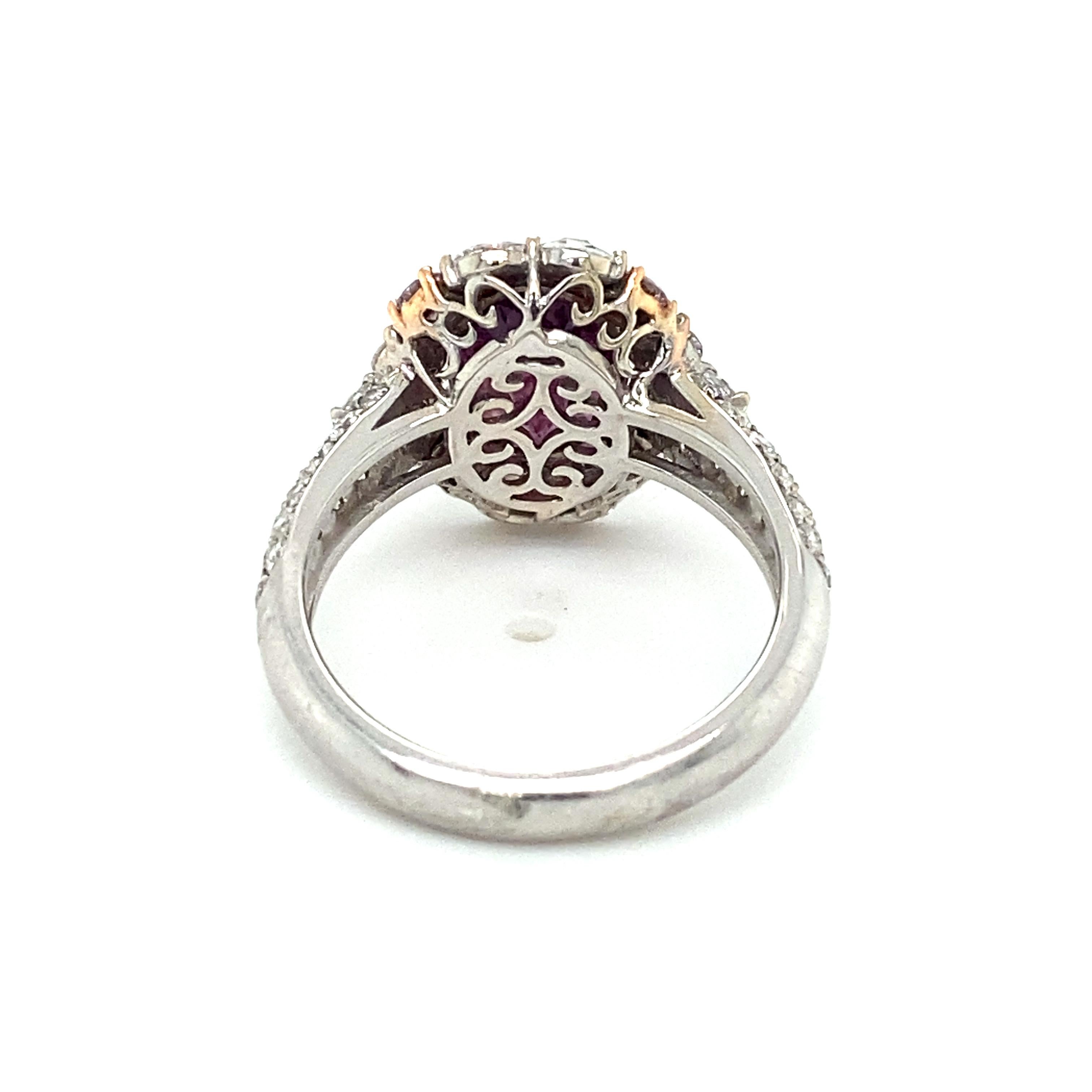 Item Details: This unique ring by Modani has a center oval purple-pink sapphire originating from Kashmir. It is surrounded and accented by both rose and round brilliant cut diamonds at approximately one and a half carats total.

Circa: 2000s
Metal