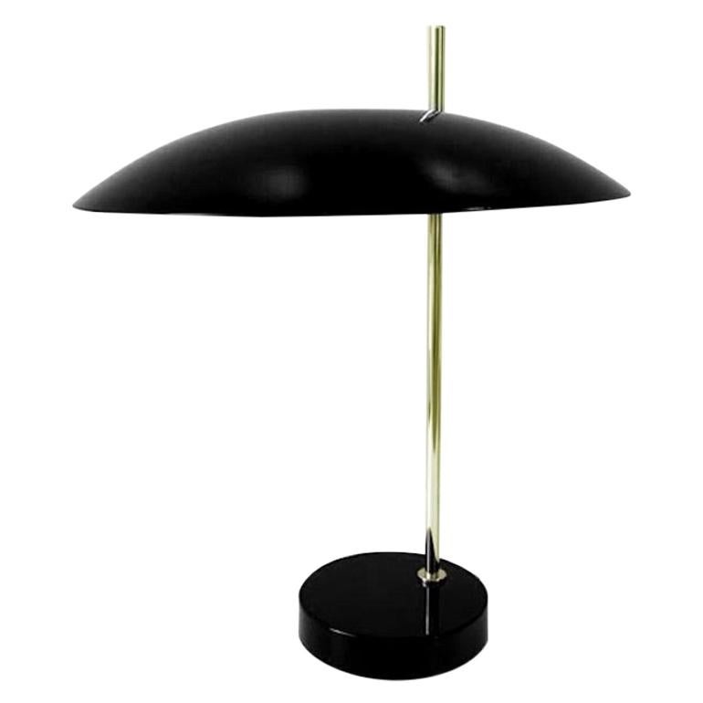 Model 1013 table lamp by Pierre Disderot. Current production manufactured in France. Enameled metal. Wired for U.S. sockets. The Model 1013 table lamp was originally designed in 1955 by Pierre Disderot. The elegant design and size made it an iconic