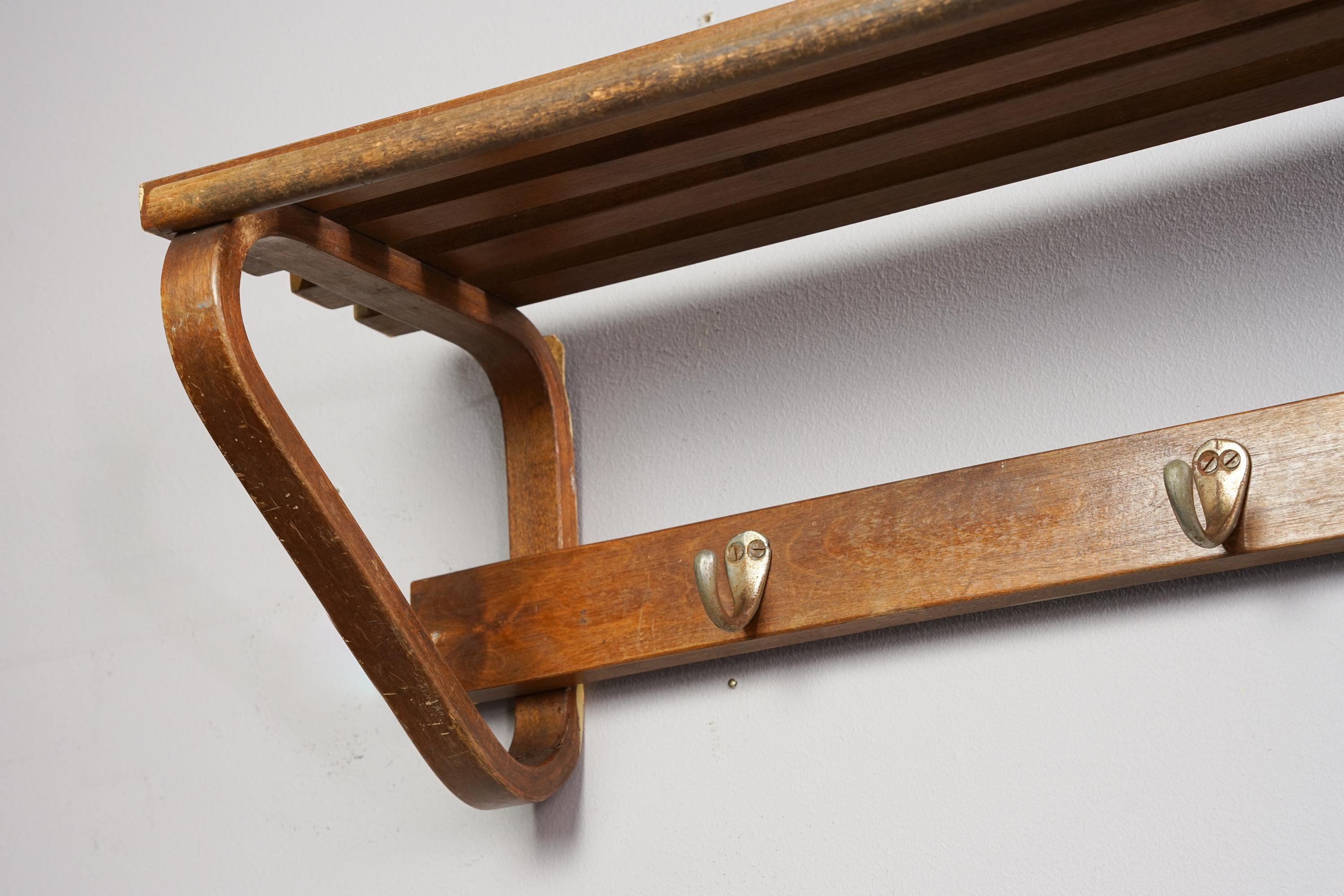 Model 109 Alvar Aalto coat rack from the 1940s. Birch with metal hooks. Good vintage condition, wear consistent with age and use. Iconic Alvar Aalto design.