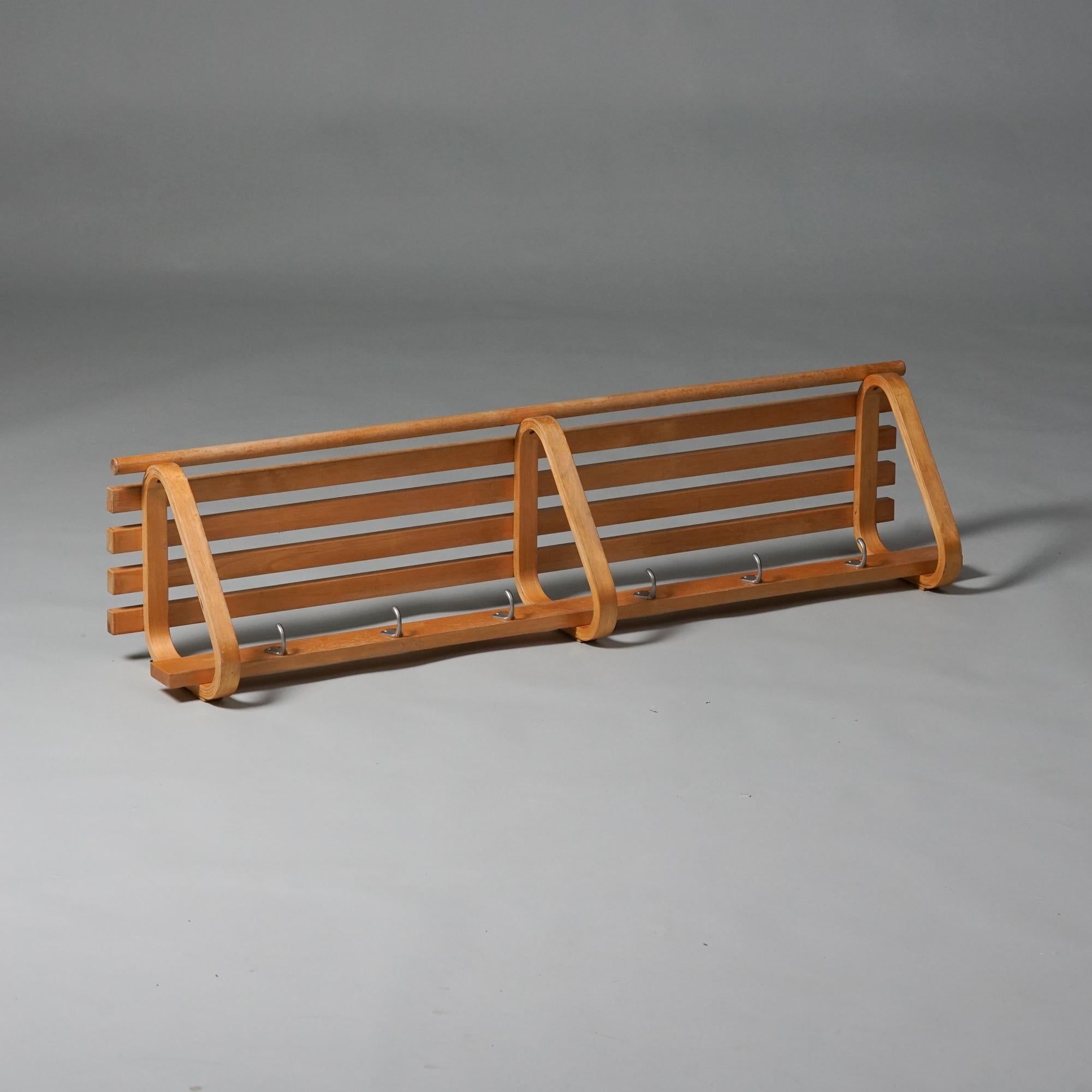 Model 109 coat rack, designed by Alvar Aalto, 1950s. Birch, metal hooks. Good vintage condition, patina and wear consistent with age and use. 

Alvar Aalto (1898-1976) is probably the most famous Finnish architect and designer in the world. Aalto