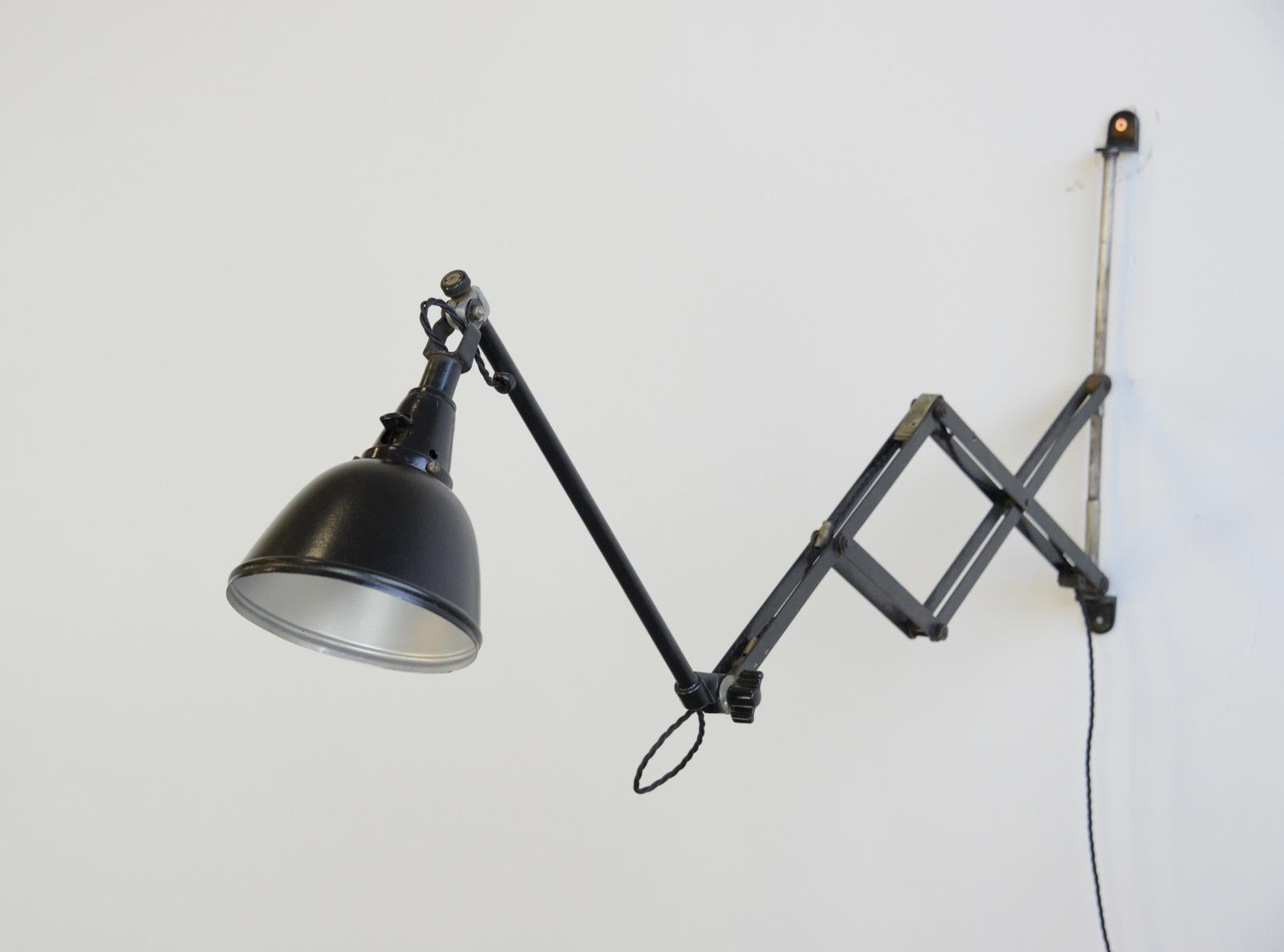 Model 110 scissor lamp by Curt Fischer for Midgard, 1930s

- Extendable scissor mechanism
- Steel shade
- Takes E27 fitting bulbs
- On/Off Switch on the cable
- Designed by Curt Fischer
- Produced by Midgard, Auma
- German, 1930s
-