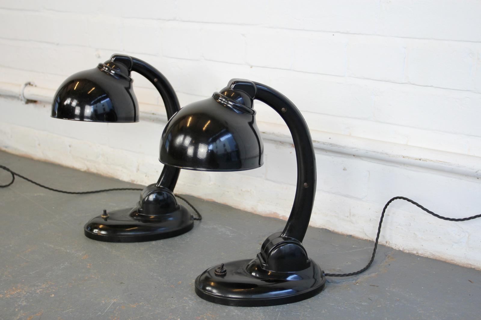 Model 11126 bakelite desk lamps by Eric Kirkman Cole, circa 1930s

- Price is per lamp (four available)
- Fully re-wired
- Original inline switches
- Bakelite shade and base
- Czech, circa 1930s
- Measures: 37 cm tall x 25 cm x 15 cm

Eric