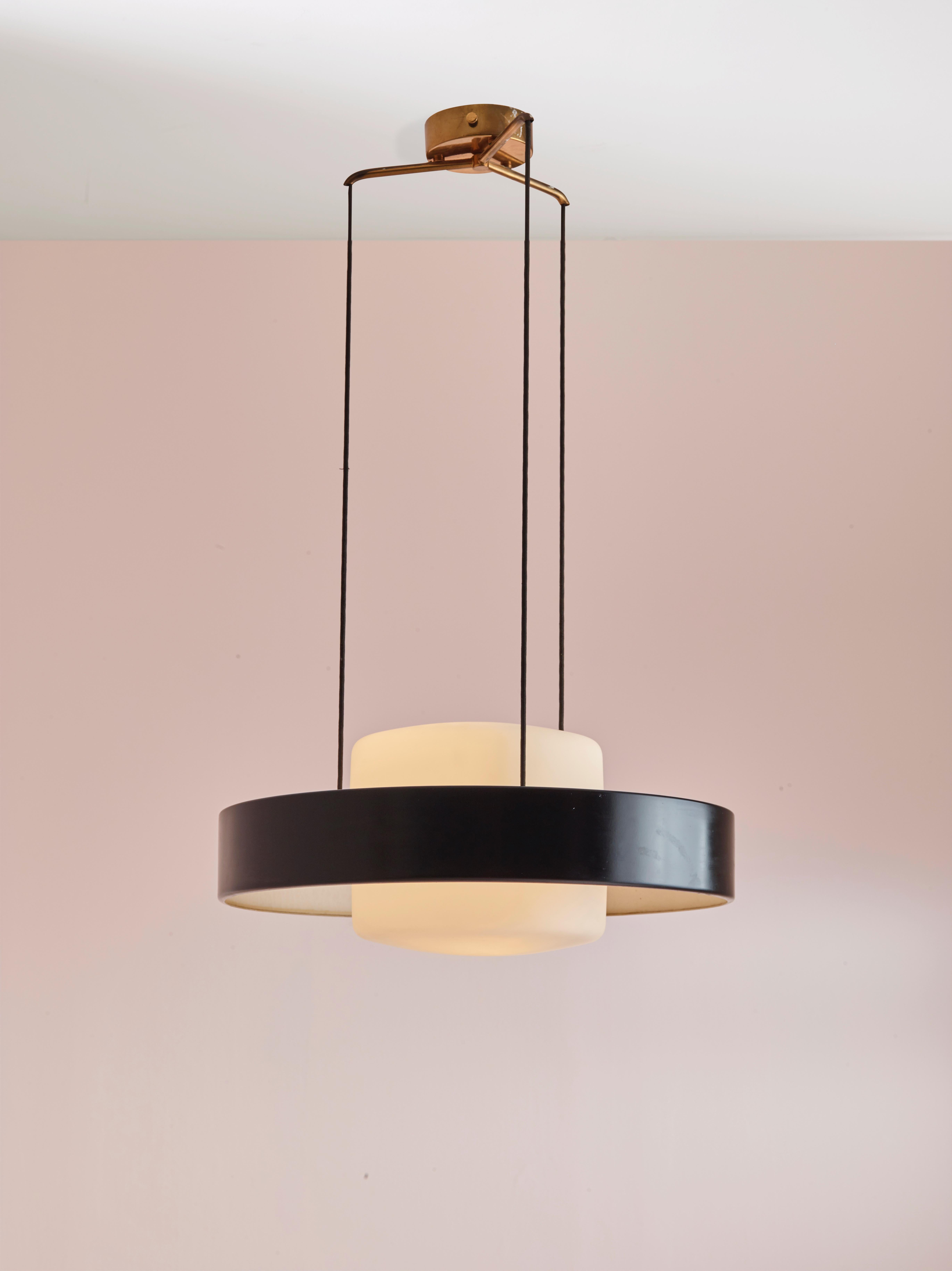 A rare 1158 suspension lamp with black lacquered aluminium, brass structure (canopy and hardware) and diffusers in opal glass. Manufactured by Stilnovo - Italy - during the 1950s, this model has been designed by Bruno Gatta.

This ceiling light is