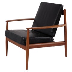 Model 118 armchair by Grete Jalk for France & Søn in teak and black leather