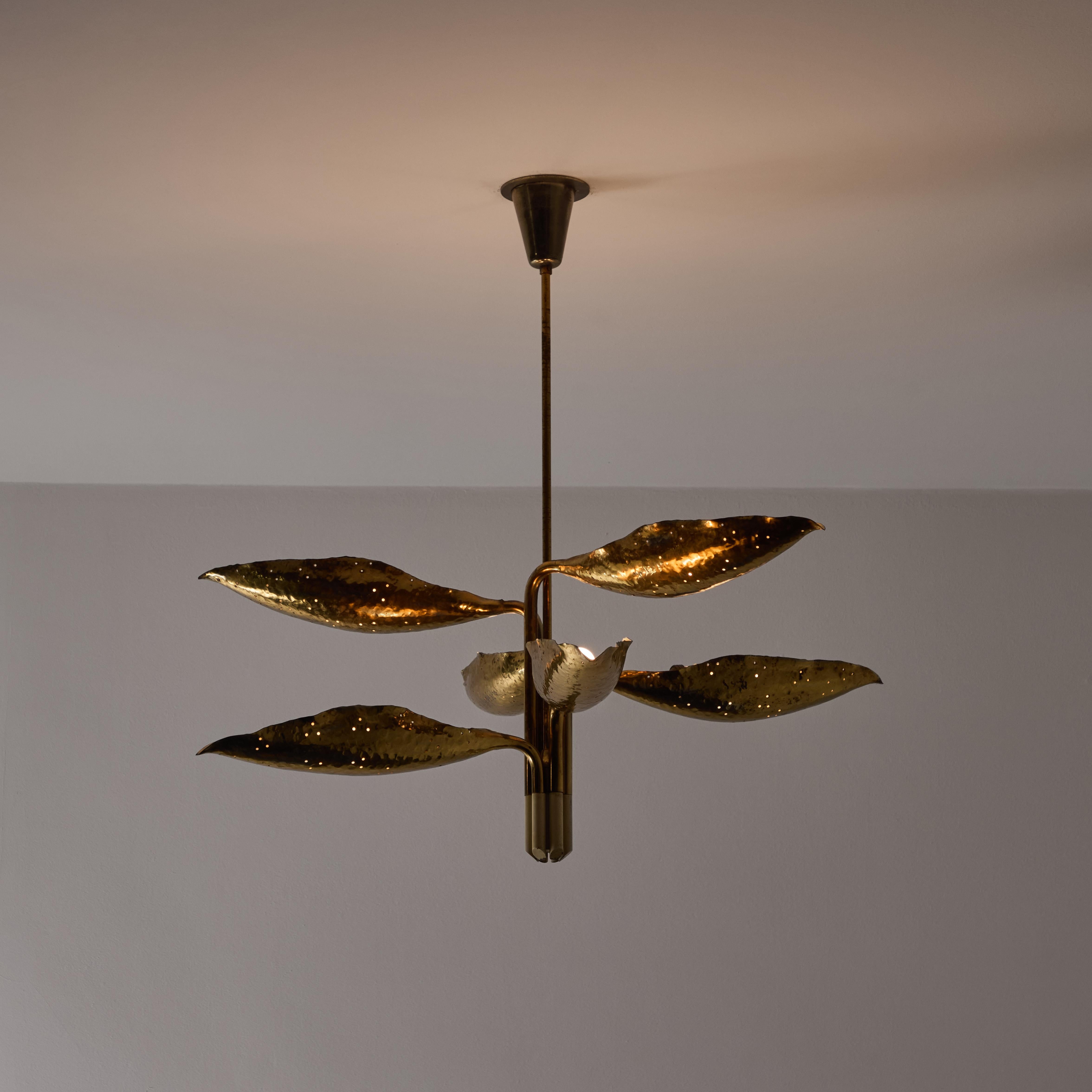 Model 12369 Ceiling Light by Angelo Lelii for Arredoluce. Designed and manufactured in Italy, circa the 1950s. All brass leaf formed shades with hammered detailing. Each leaf is stemmed and flows from a centralized suspension rod. The stems can be