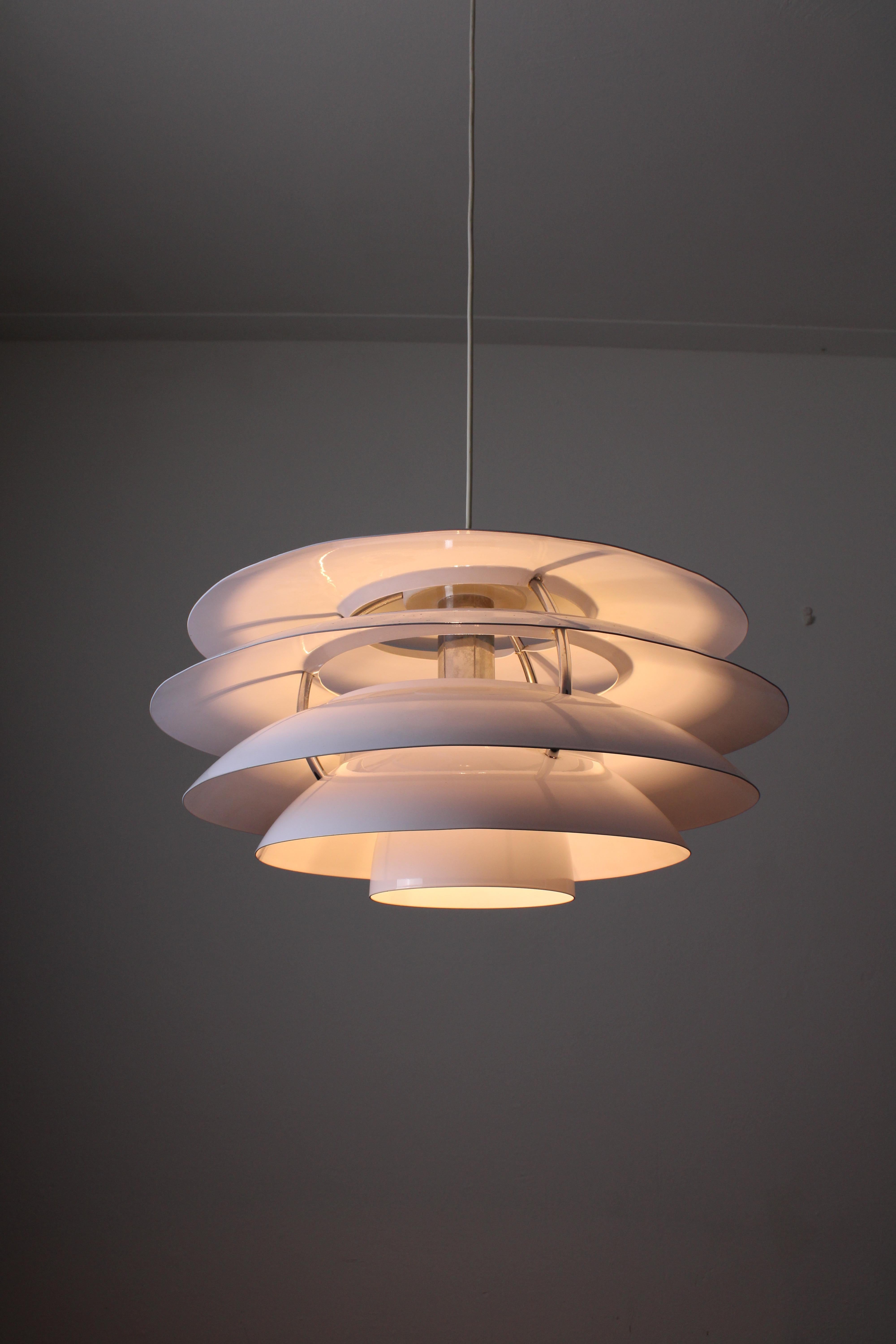 Pendant lamp, model 1262 designed and produced by Stilnovo in Italy circa 1960s. Stilnovo designed many lamps in the classic Italian style, apart from this lamp that is rather close to Scandinavian style. Due to the large white shades, the light is