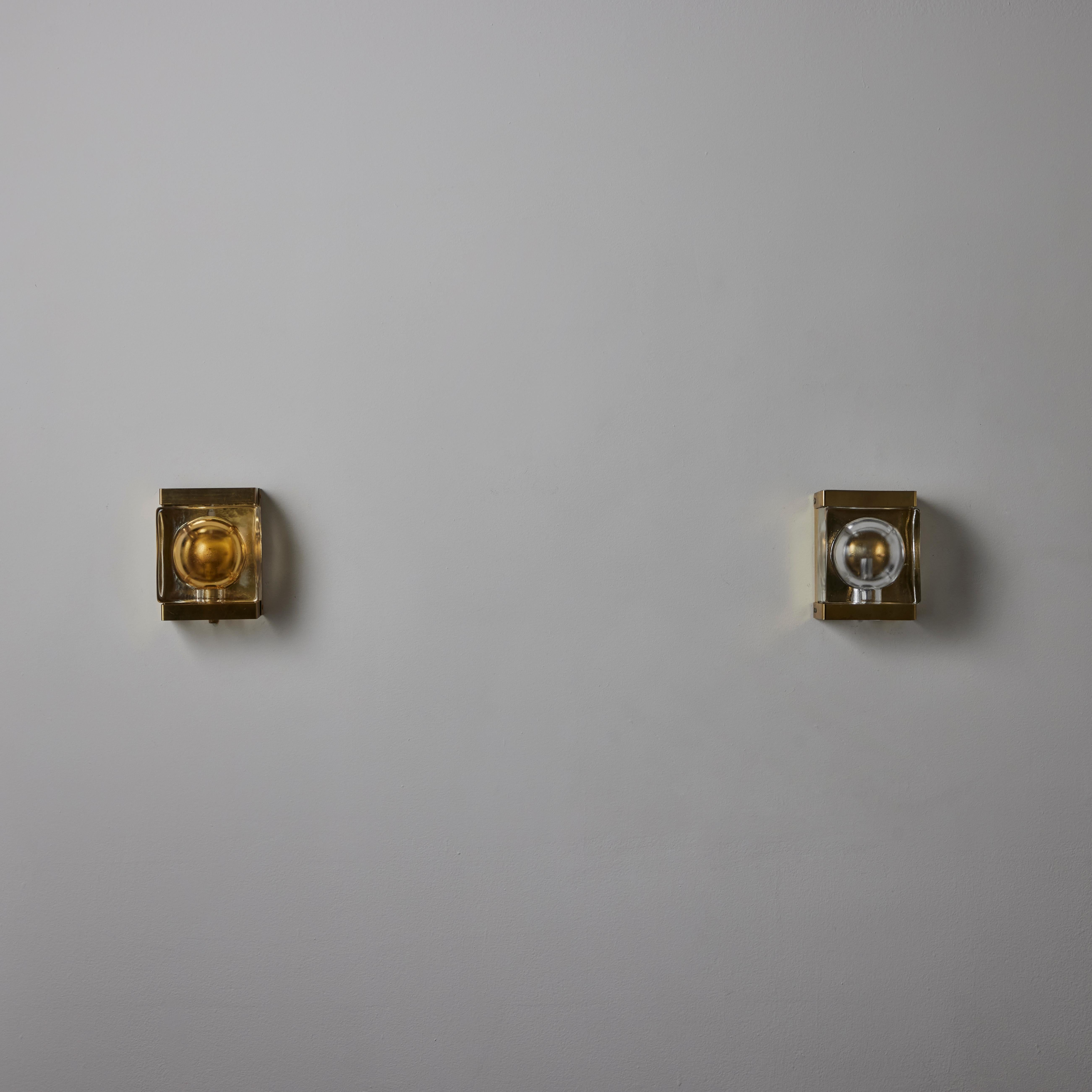 Model 15806 Sconces by Vitrika. Designed and manufactured in Denmark, circa 1960s. Brass and molded glass. Wired for US junction boxes. Maintains original manufacturer's label. Each sconce takes an E14 40W maximum bulb. Sold individually.

Please