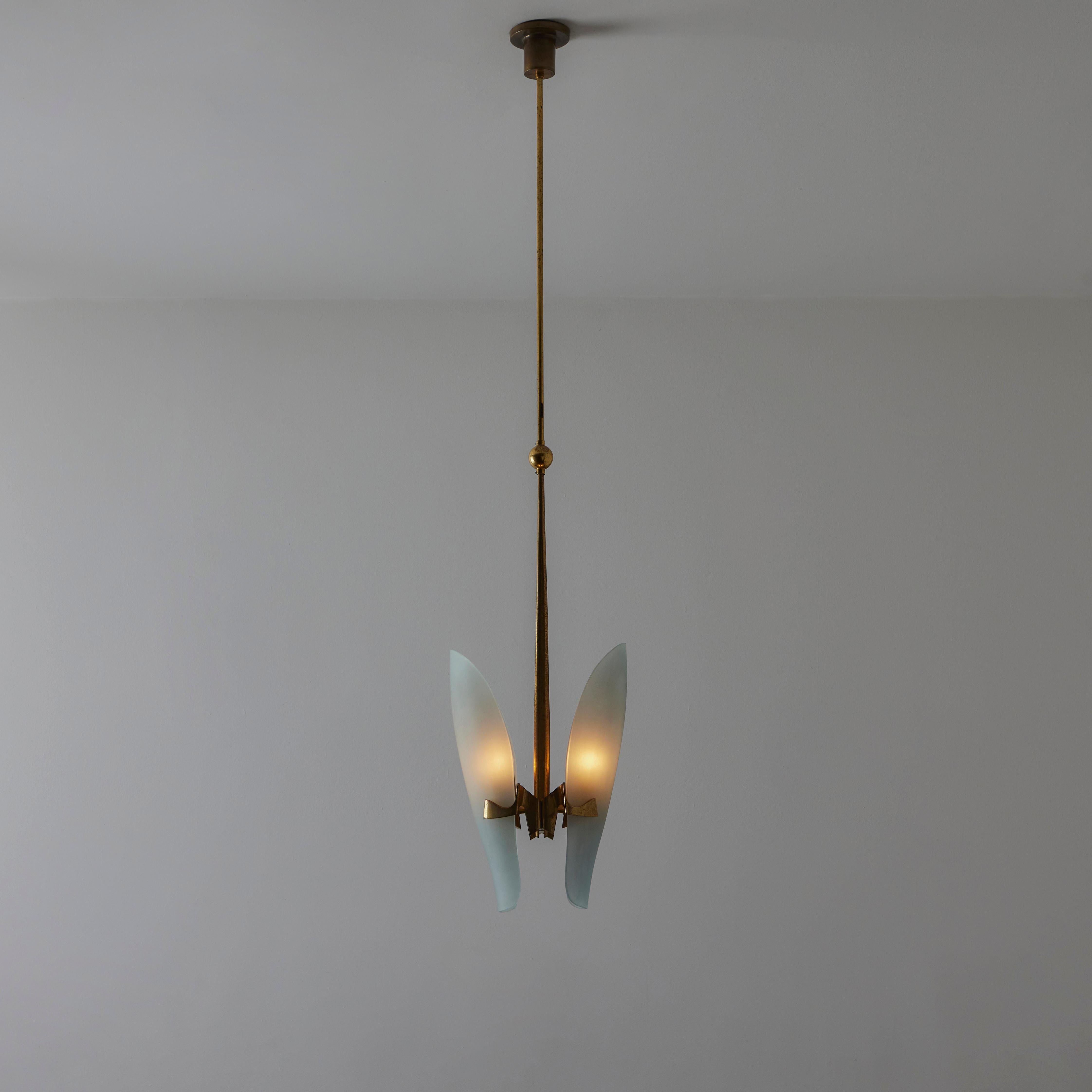 Model 1636 Pendant by Max Ingrand for Fontana Arte. Designed and manufactured in Italy, circa the 1950s. A gorgeous polished brass drop pendant featuring a rather complex design at the bottom where two etched pieces of identical glass are hoisted on