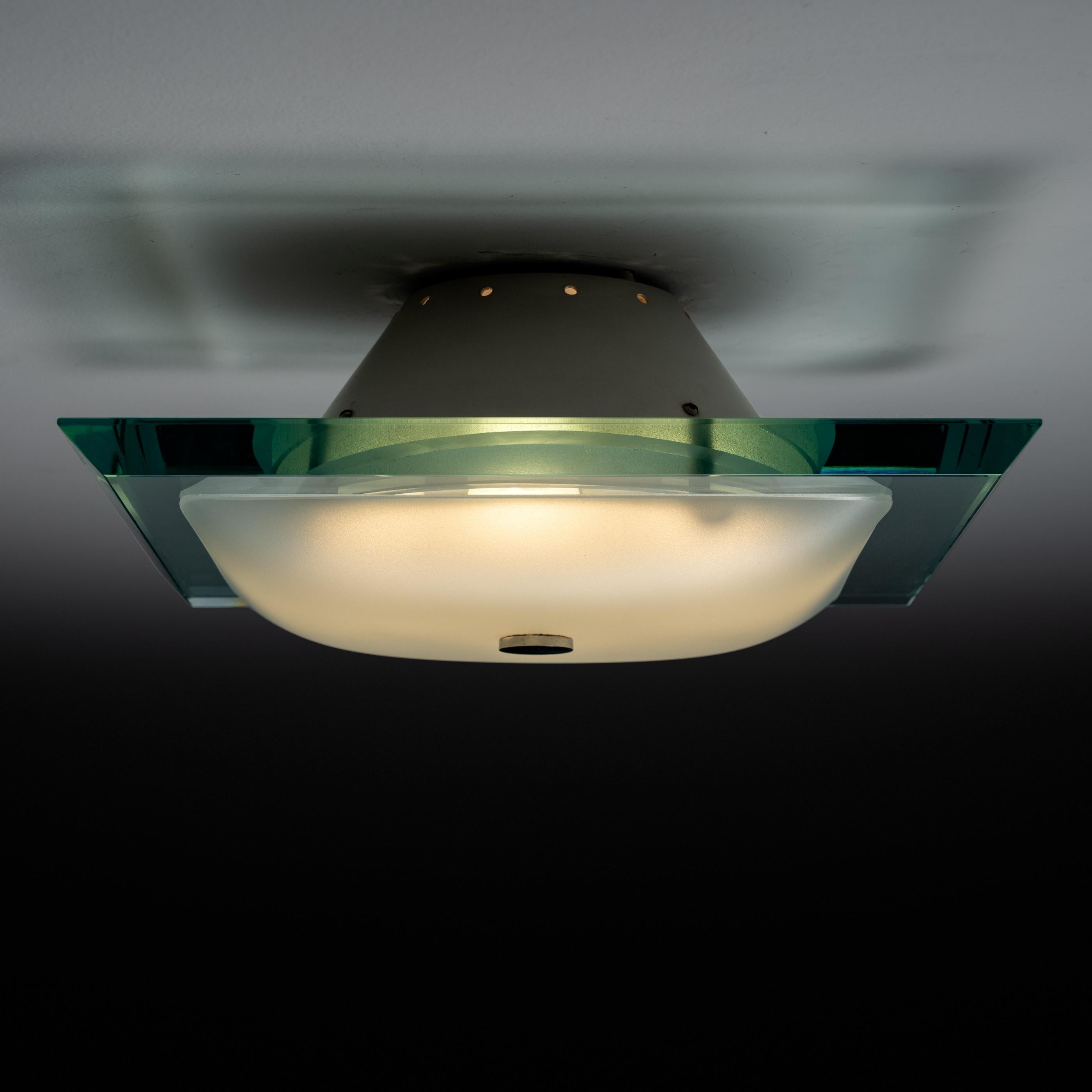 Model 1990 designed by Max Ingrand for Fontana Arte. Manufactured in Italy. Ground crystal glass, Polished Nickel, with enameled white canopy. We recommend four E14 20watt maximum bulbs. Bulbs not included.