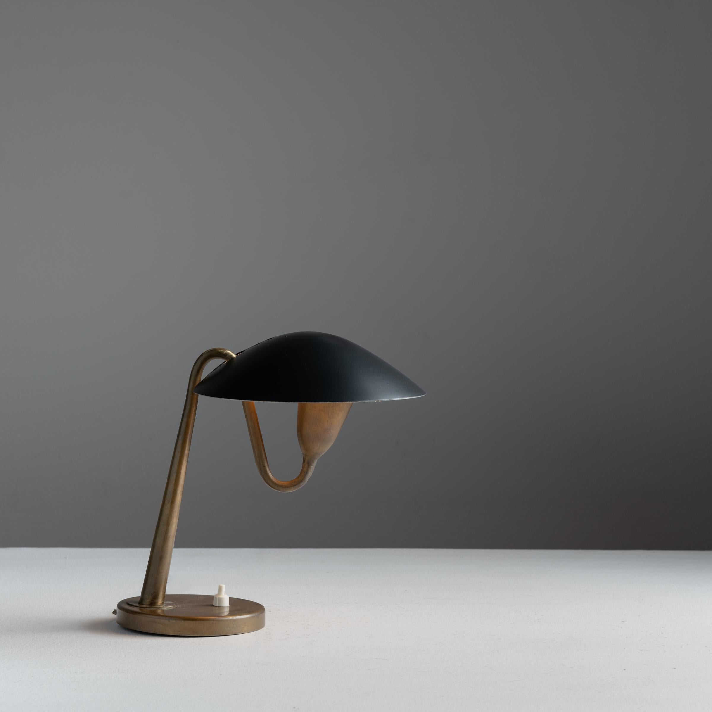 Model 200 table lamp by Giuseppe Ostuni for Oluce. Designed in Italy, circa 1950s. Wired for the US. We recommend one E12 base 75w maximum bulb.