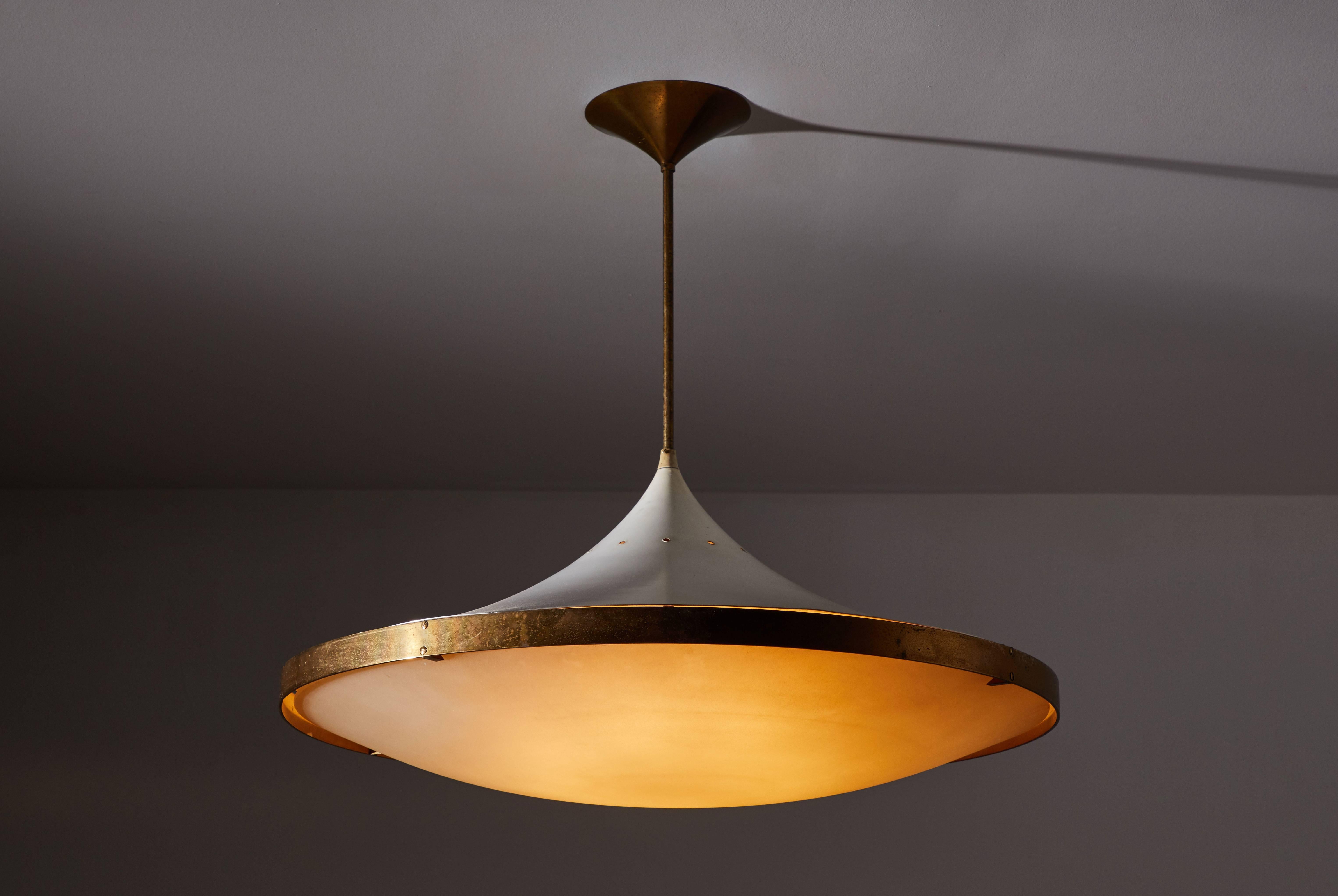 Model 2064 chandelier by Max Ingrand for Fontana Arte designed in Italy, 1955. Polished brass, lacquered metal, curved satin crystal diffuser. Wired for US junction boxes. Original canopy. Takes one E27 75w maximum bulb. Literature: Quaderni Fontana