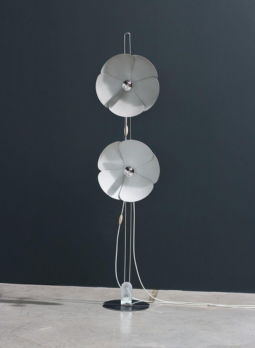 The standing flower designed by Olivier Mourgue for Disderot, 1968. This standing flower lamp with reflecting bulbs and 2 bent petals has flowers positioned on a chrome wire with a round divided base.
Pascal and Olivier Mourgue are two French