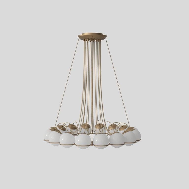 Model 2109 16 14 suspension light by Gino Sarfatti. Current production designed and manufactured in Italy. Opaline glass diffuser, enameled steel armature, champagne finish. In 1959, the Le Sfere was launched in a solar system of its own, revolving