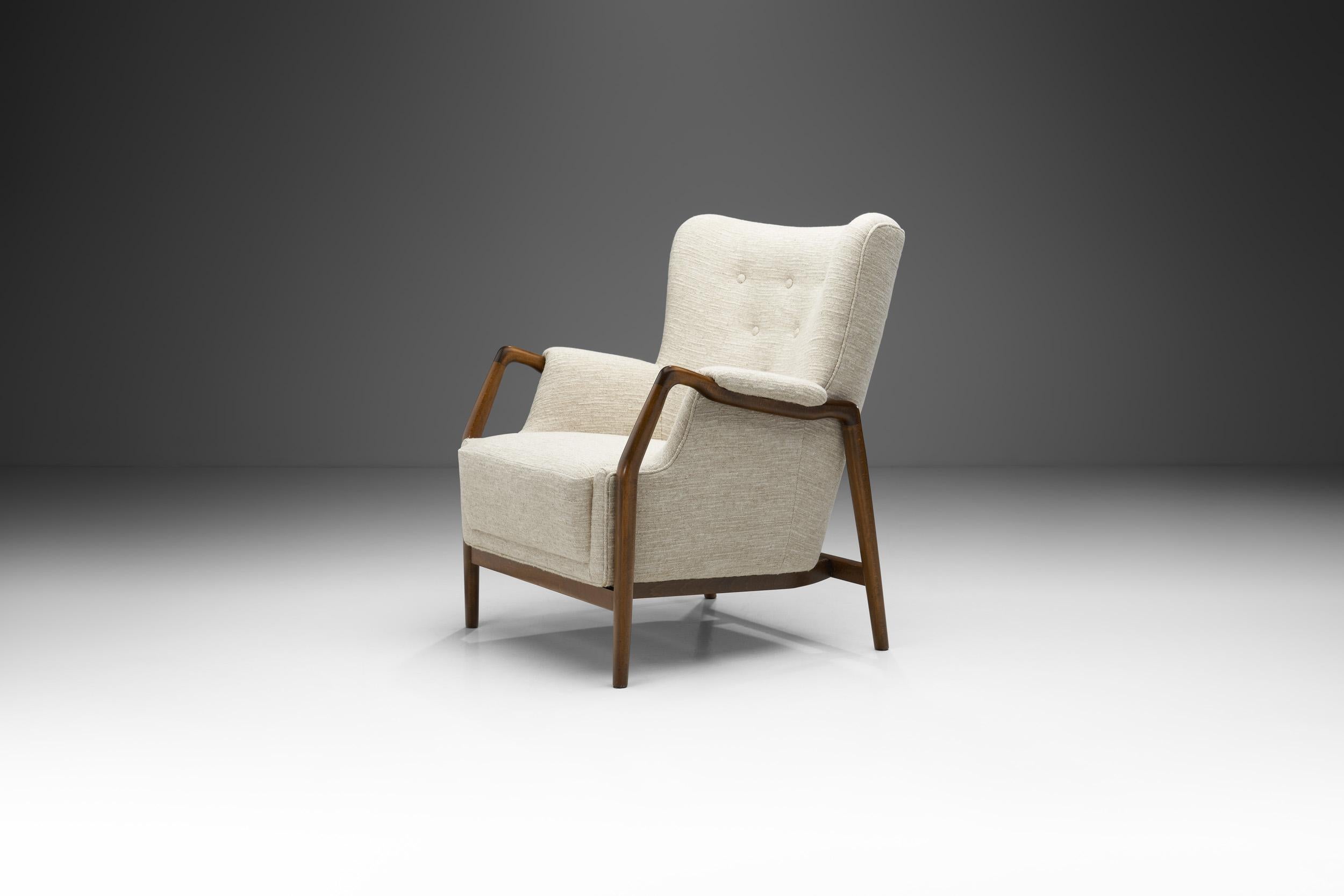 This rare “Model 214” armchair was designed by Danish designer and architect Kurt Olsen, and unifies some of the best characteristics of mid-century Danish design and craftsmanship.

The unique design of this chair is in big part thanks to Olsen’s