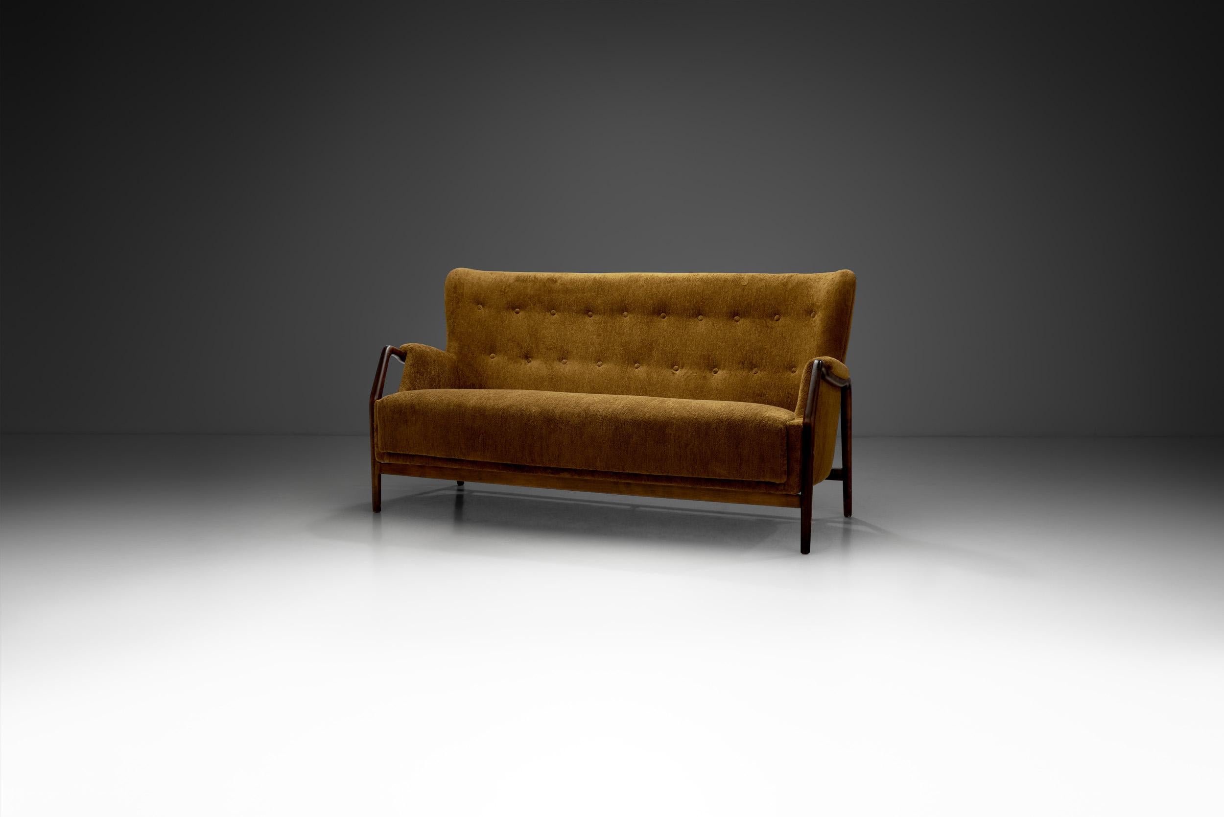 The “Model 214” sofa was designed by Danish designer and architect Kurt Olsen during the 1960s and unifies some of the best characteristics of the Danish Mid-Century Modern movement’s design aesthetic and craftsmanship.

Like many of his