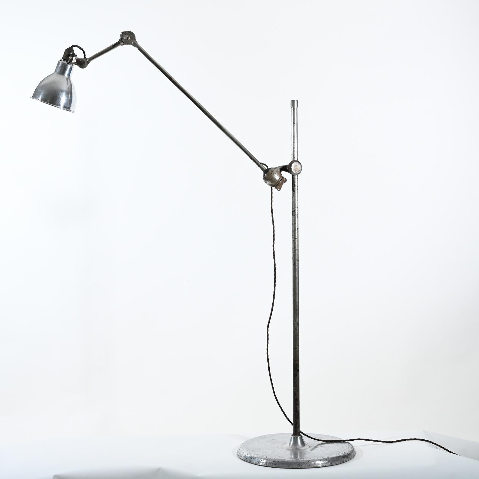 Rare nickel-plated and aluminium Gras model 215 mobile floor lamp with aluminium “Normal” lampshade produced in 1930. 

The Gras lamp became popular when Le Corbusier started to use them first in his offices and then for his customer projects.