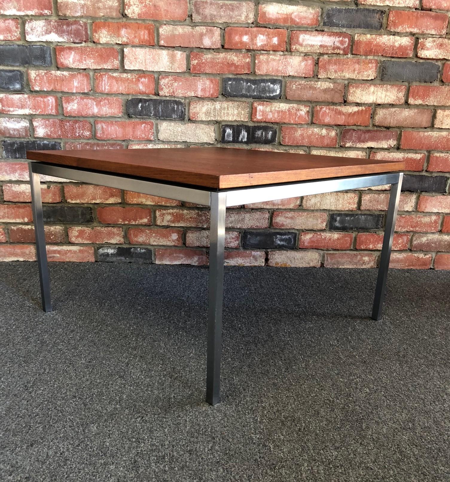 Model 2514 side / end / occasional table by Florence Knoll, circa 1960s. Florence Knoll's designs are famous for their understated quality, refined details and timeless appeal. This model 2514 has a professionally refinished walnut top on a