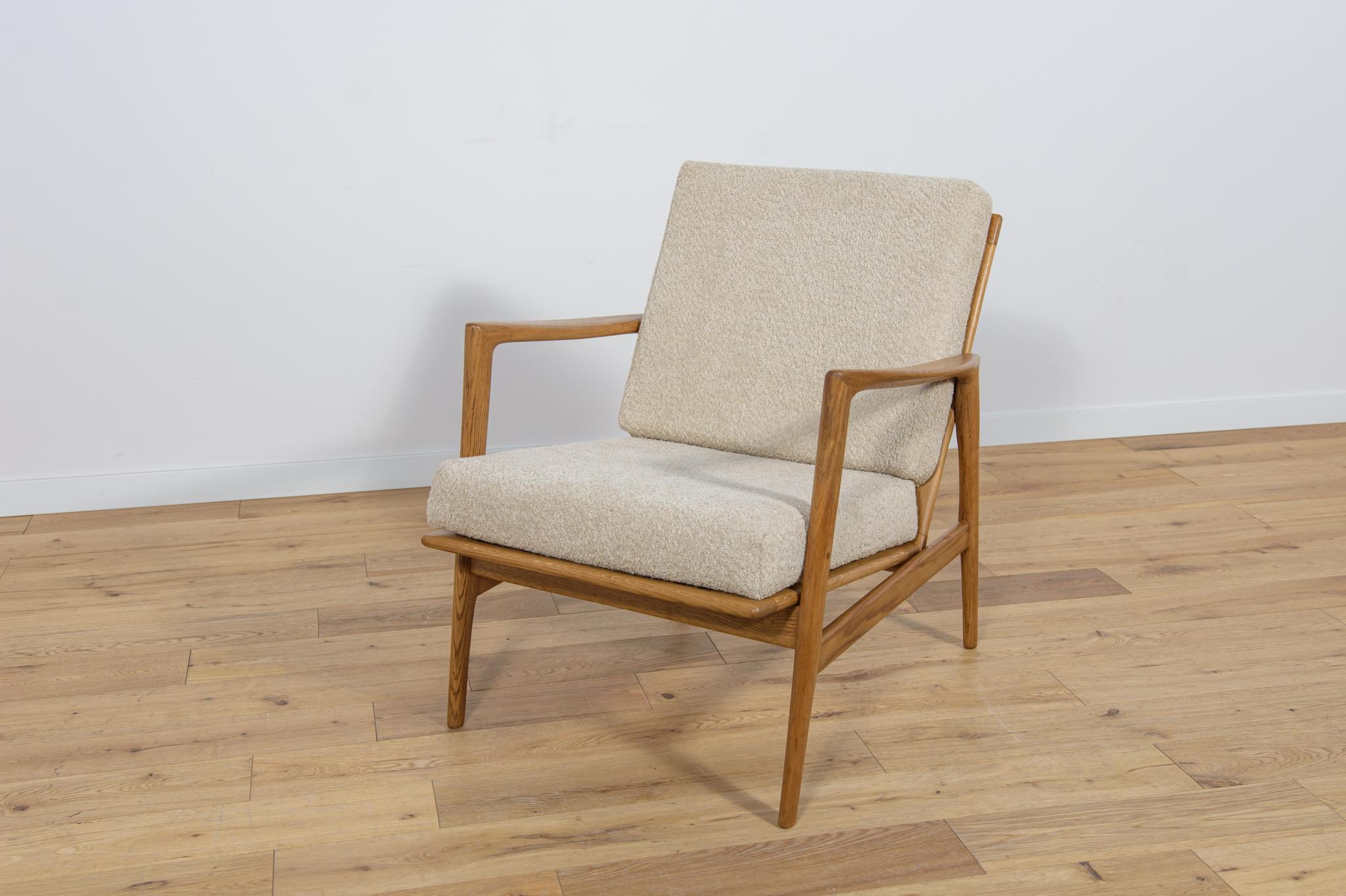
The armchair model 300-139 that was produced by the Polish company Swarzędzka Furniture Factory. Comfortable armchair with a unique form. Armchair have been professionally restored. The wooden structure has been cleaned and polished with a oak wax.