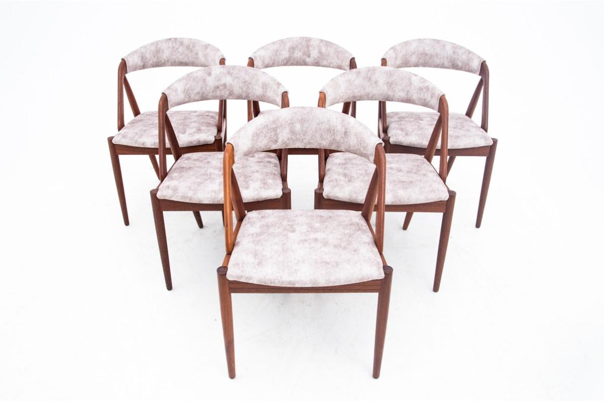 Set of six teak chairs designed by Kai Kristiansen. The classic, iconic model 31. Light, stable and interesting structure. The chairs have undergone restoration of wood.

The furniture is in very good condition, the seats and backrests are covered