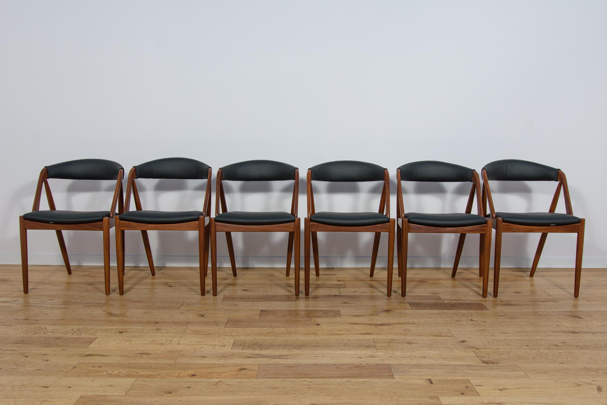 A set of six chairs Model 31 designed by Kai Kristiansen for the Danish manufacture Schou-Andersens Møbelfabrik in the 1960s. Frame made of teak wood. Completely restored. Wood has been cleaned of old coating, finished with Danish Oil . Foams