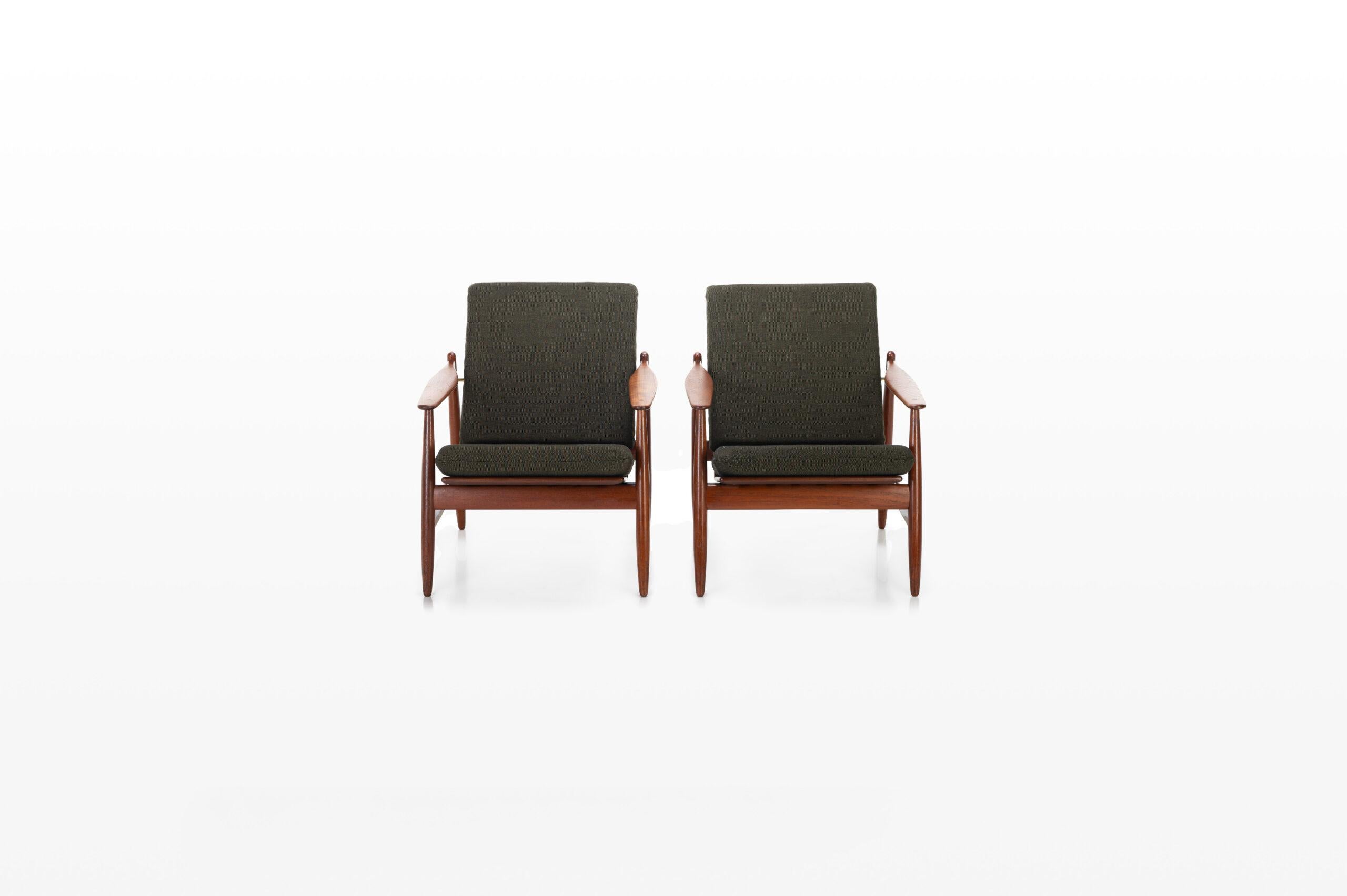 Beautiful set of two “Model 340” easy chairs in teak and brass details. Designed by Poul Volther and produced by Frem Røjle, Denmark 1960s.
 