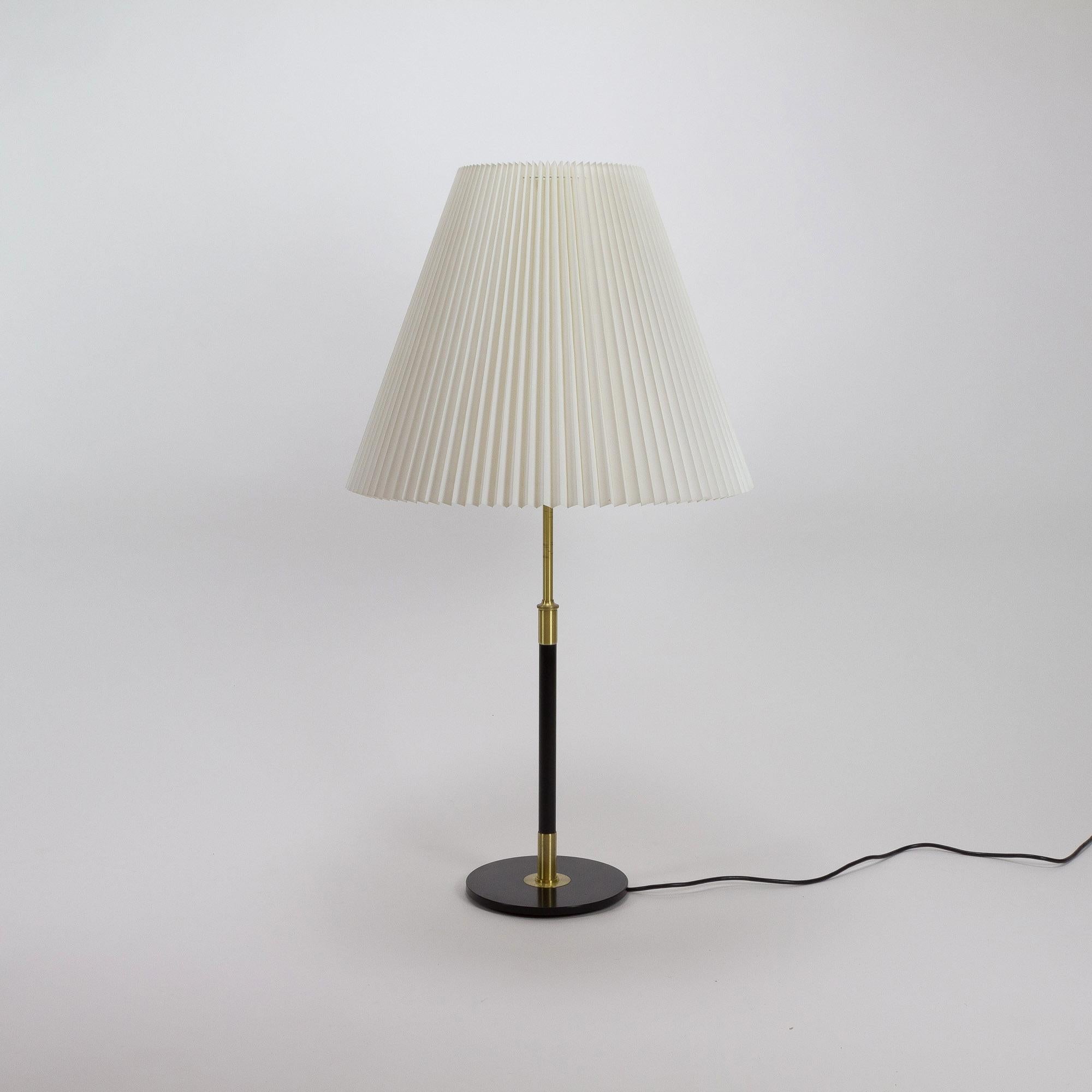 Model 352 adjustable table lamp by Aage Petersen for Le Klint Denmark in 1972 in brass and black lacquered metal. The 352 can be used on a desk, side table or sideboard and even on the floor. The height adjusts from 62cm to 88cm and the large Le