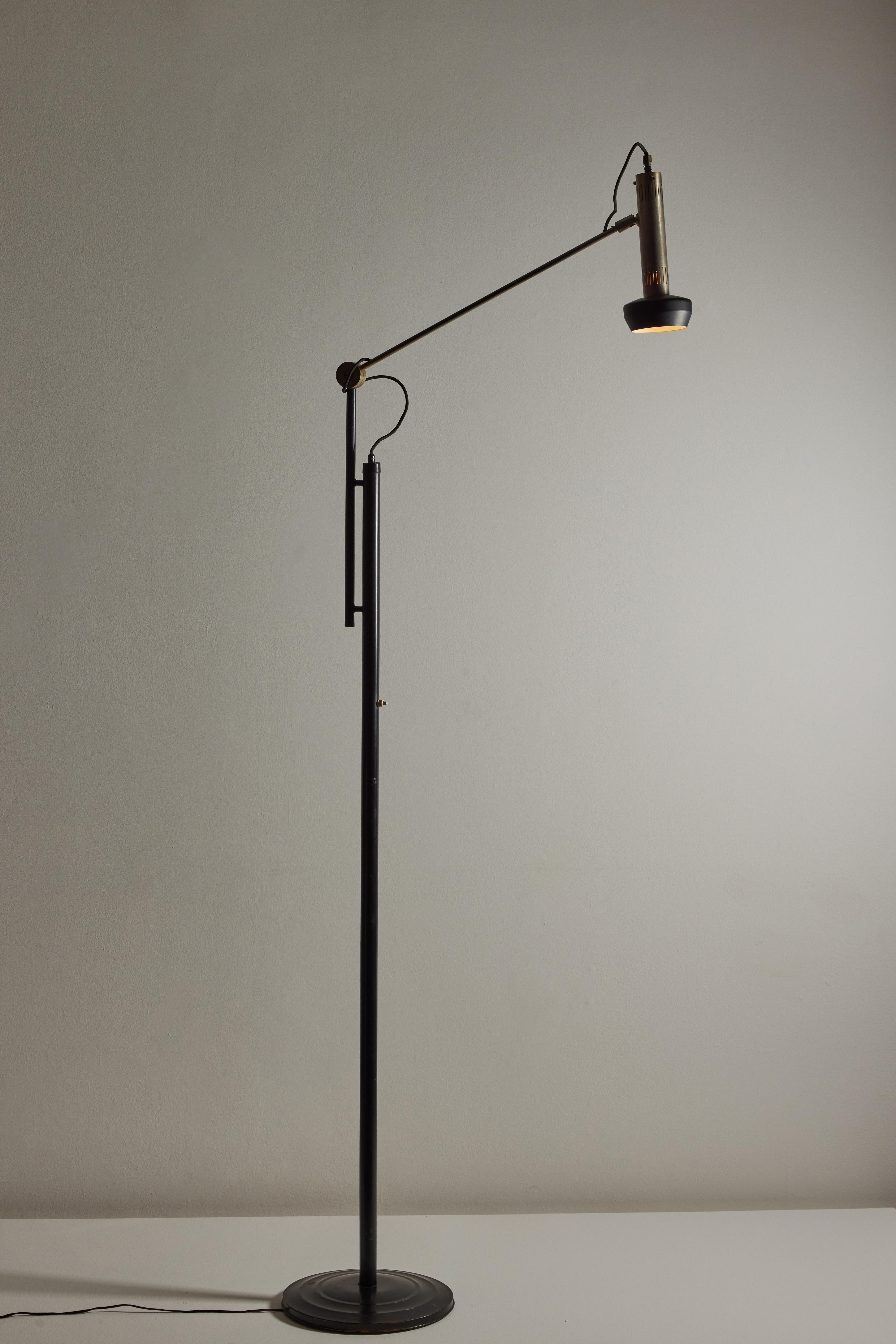 Model 397 floor lamp by Tito Agnoli for Oluce. Designed and manufactured in Italy, 1954. Brushed nickel, steel, painted metal. Original cord, US adaptor included. Adjustable height, arm and shade adjust to various positions. We recommend one E27