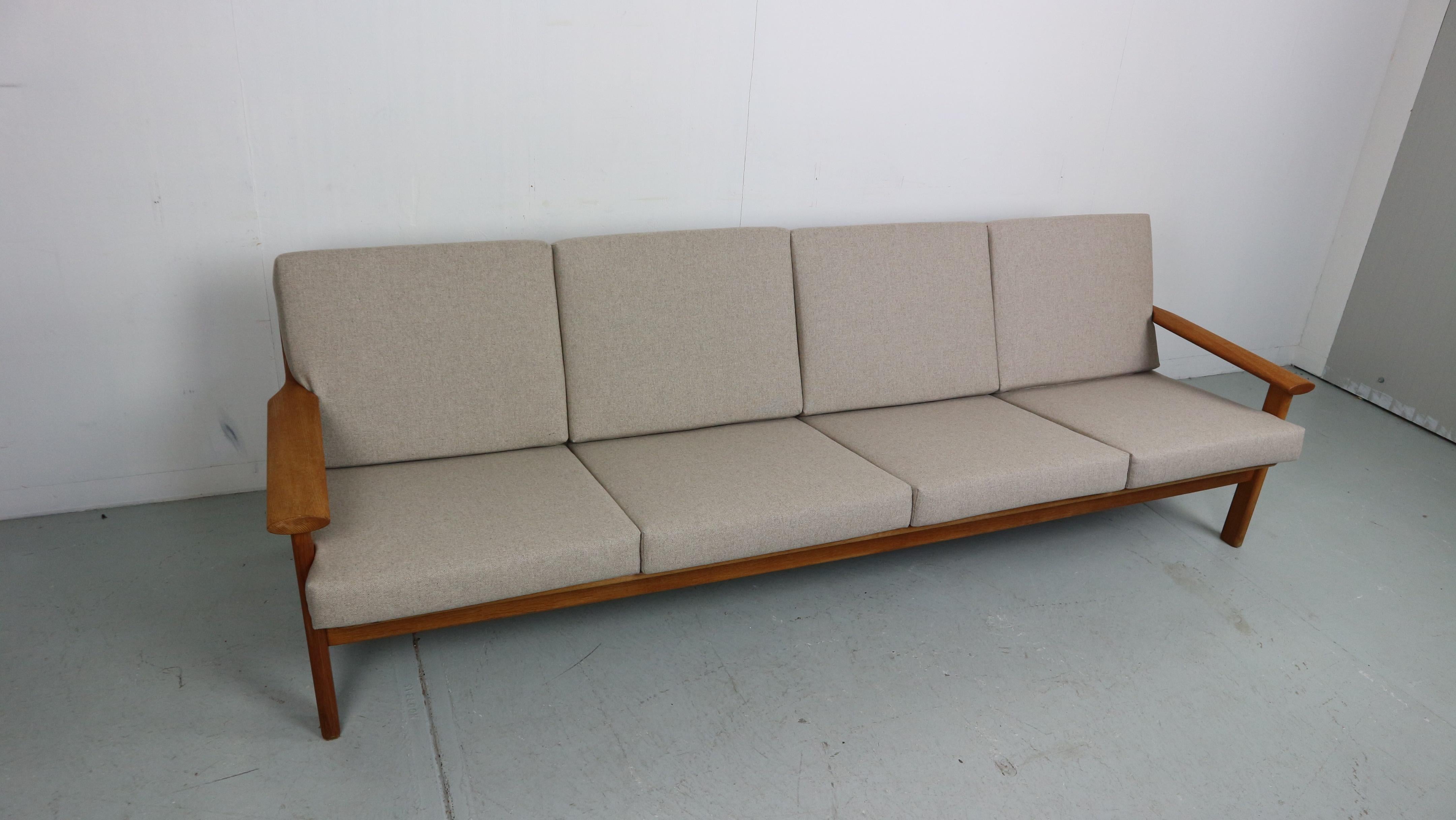 Poul M. Volther, four-seater sofa, model 390 for Frem Røjle Møbelfabrik. Structure of solid oak wood with loose cushion, newly filled and upholstered in light beige wool (shiitake) color. New webbing and refinished in furniture oil.
Cushion fabric