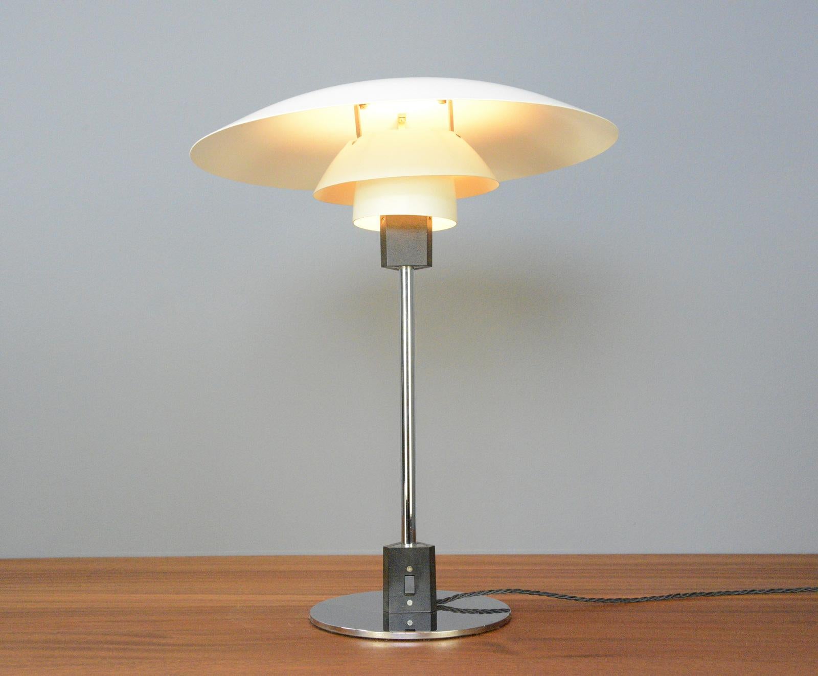 Model 4/3 table lamp by Louis Poulsen Circa 1960s

- Chromed steel base and stem
- On/Off switch on the base
- Stepped steel shade
- Takes E27 fitting bulbs
- Designed by Poul Henningsen
- Produced by Louis Poulsen
- Danish ~ 1960s
- 45cm