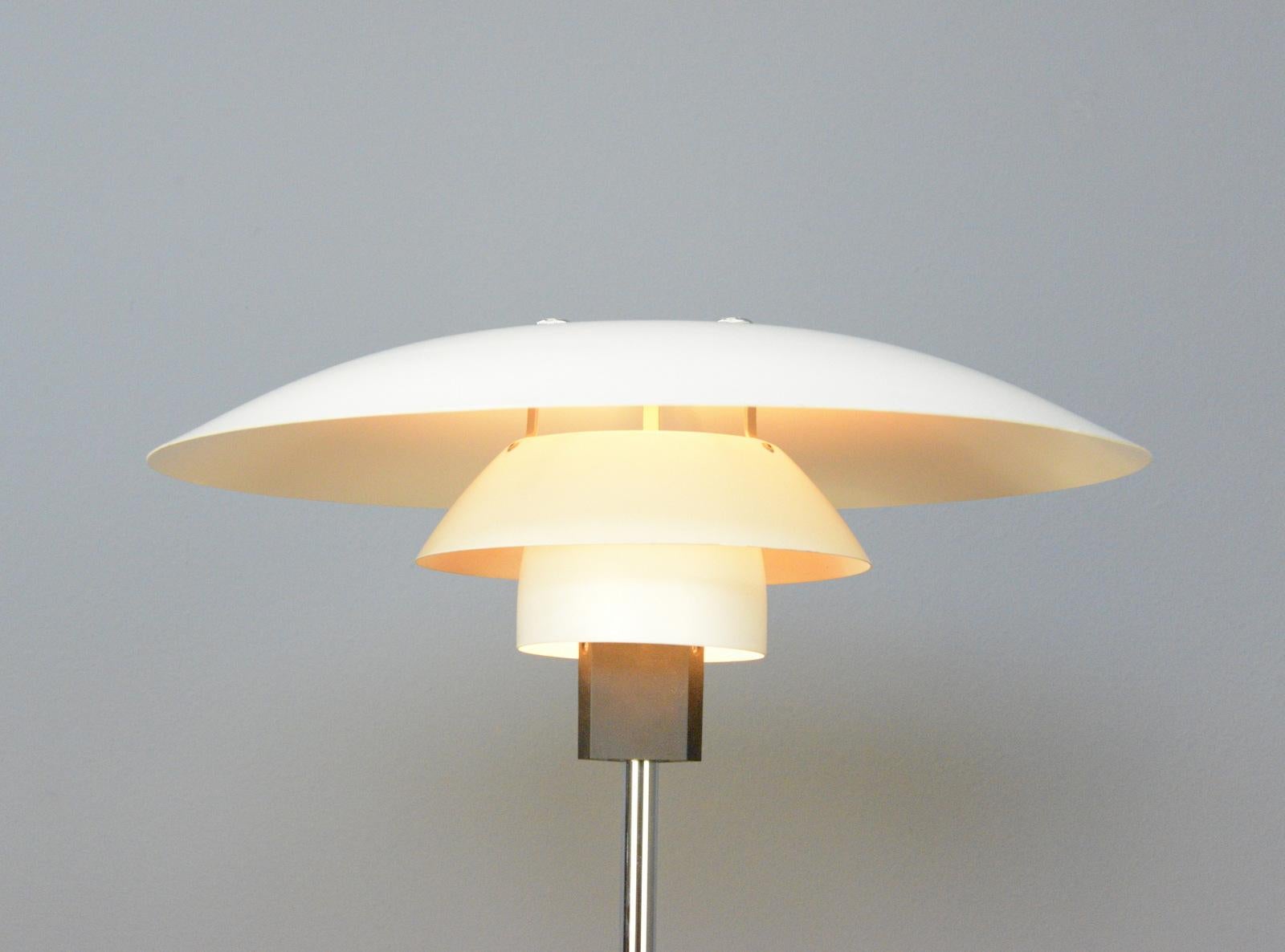 Model 4/3 table lamp by Louis Poulsen Circa 1960s.

- Chromed steel base and stem
- On/Off switch on the base
- Stepped steel shade
- Takes E27 fitting bulbs
- Designed by Poul Henningsen
- Produced by Louis Poulsen
- Danish ~ 1960s
- 45cm