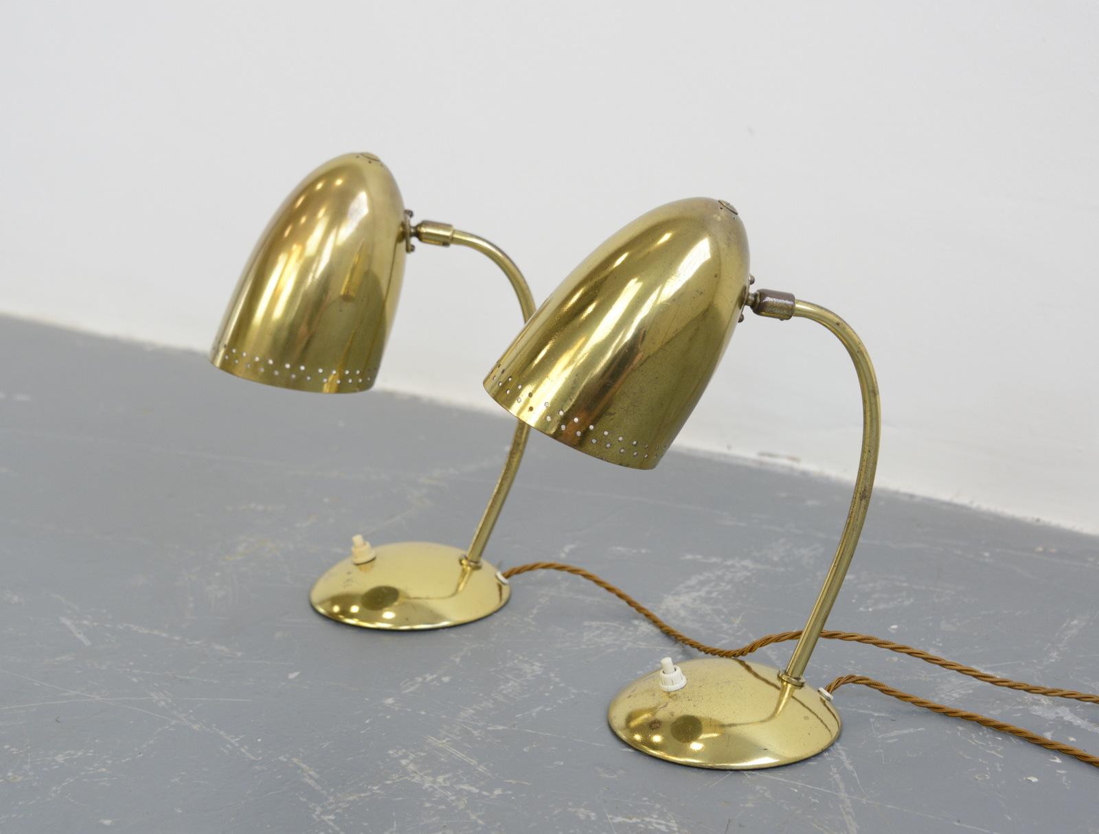 Model 4007 table lamps by Christian Dell for Kaiser Idell, circa 1930s

- Price is per lamp
- Solid brass shade
- Articulated head on a small ball and socket joint
- On/Off switch on the base
- Takes E27 fitting bulbs
- Designed by Christian