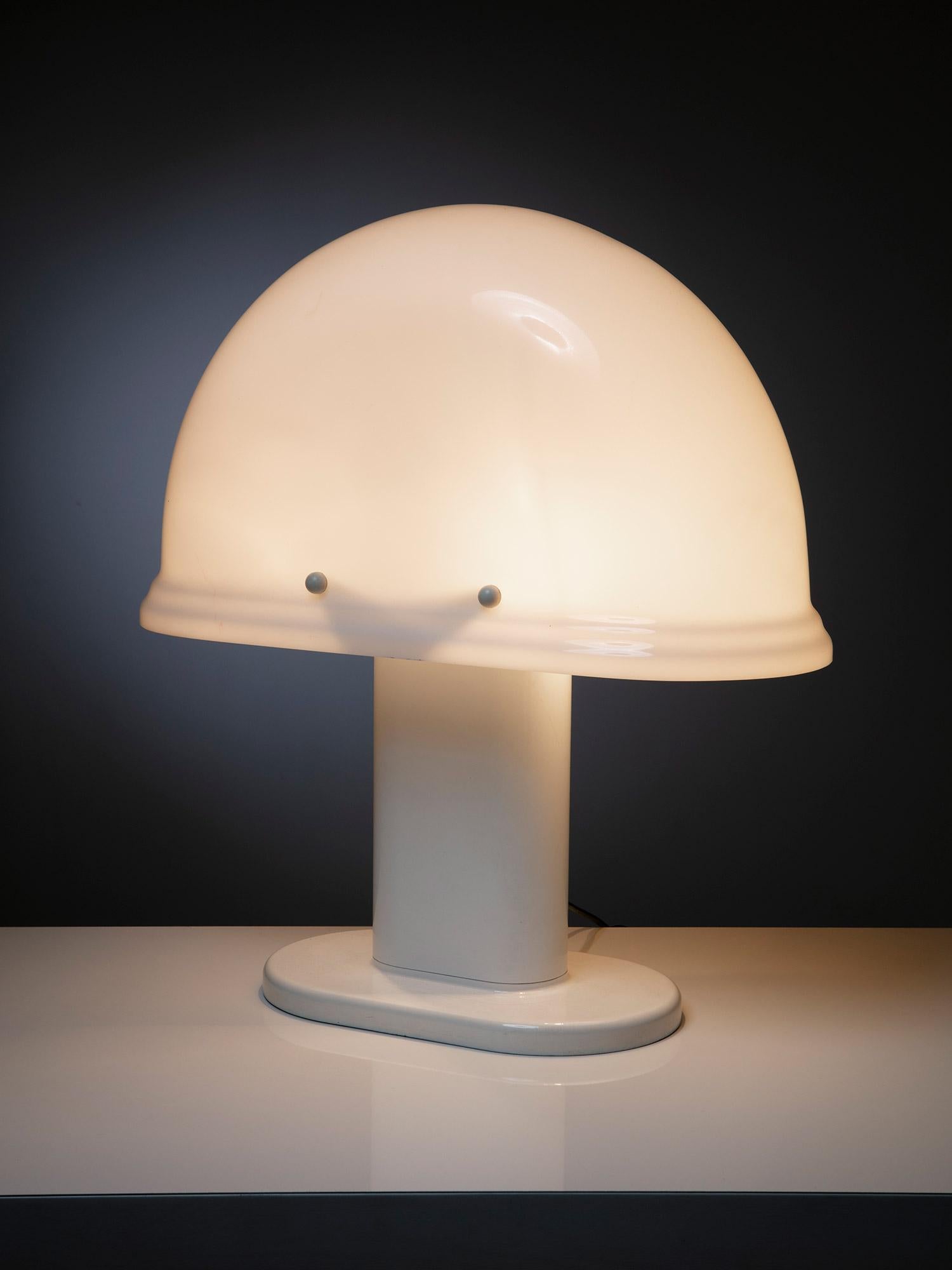 Large table lamp model 4054 by Rodolfo Bonetto for Guzzini.
A large plexiglass shade supported by a white lacquered metal base.