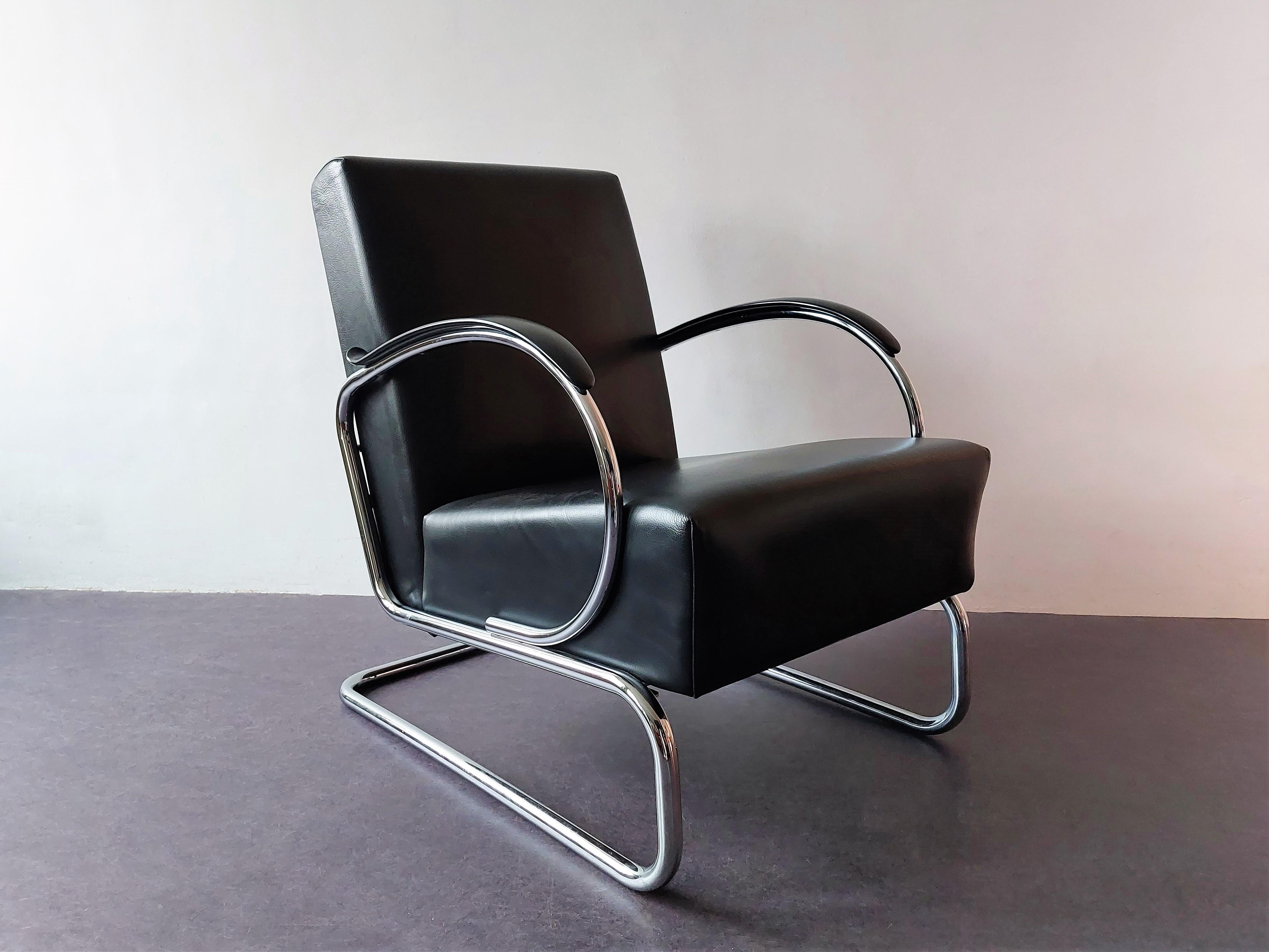 The classic model 407 chair was designed by Wilhelm Hendrik Gispen in 1931. This particular chair was made by Dutch Originals who produces some Gispen Classics. It has a black leather seat, with an additional small black leather cushion. The frame