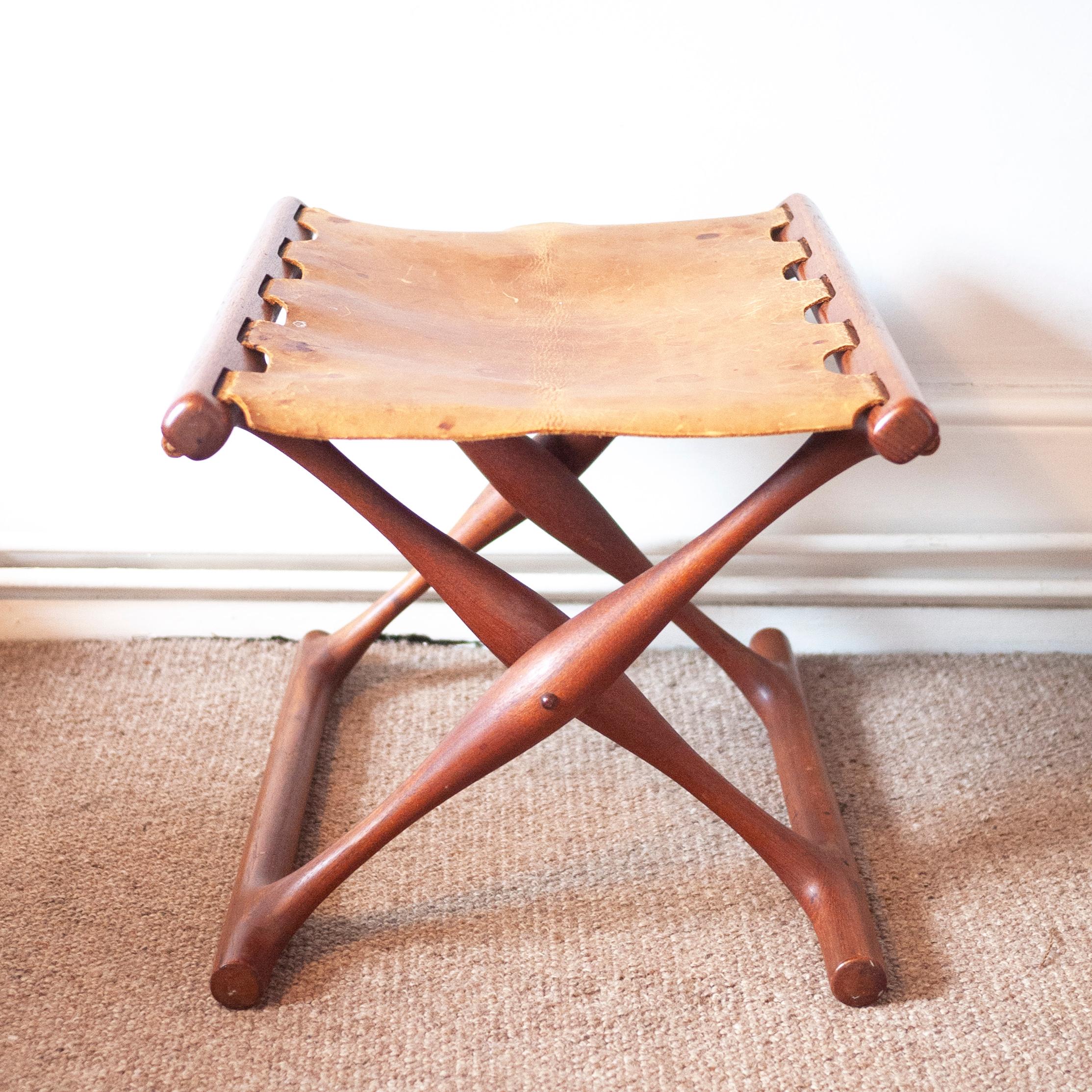Model 41 folding stool in teak with original, patinated cognac brown saddle leather seat. 

Designer - Poul Hundevad

Period - 1950 to 1959

Country of Manufacturer - Denmark

Style - Vintage

Detailed condition - Good in keeping with age