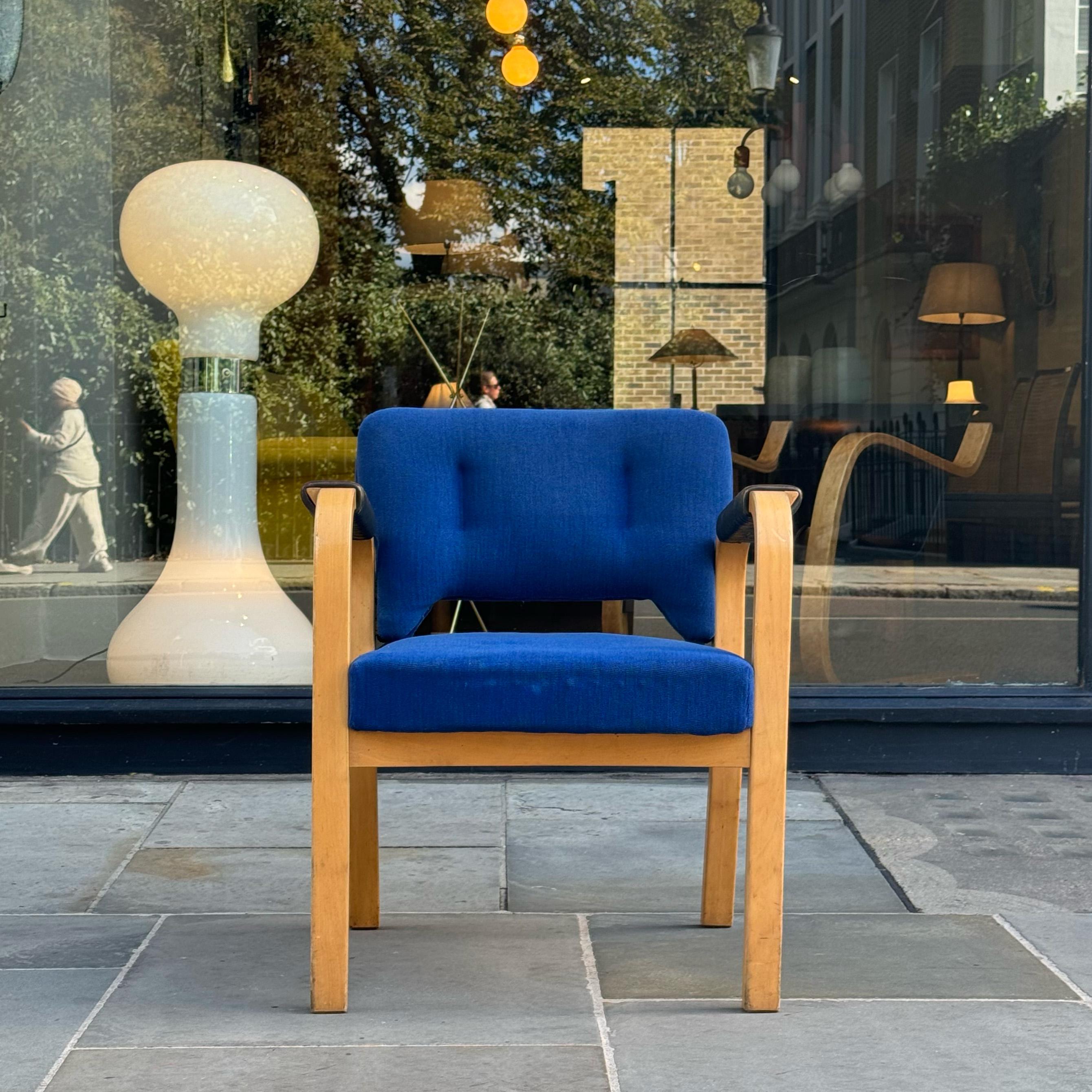 A substantial carver armchair designed by Maija Heikinheimo with Alvar Aalto for Artek circa 1950.

Visually, the frame of the chair is most informed by the legs. To create the legs on each side of the chair, one section of laminated wood has been