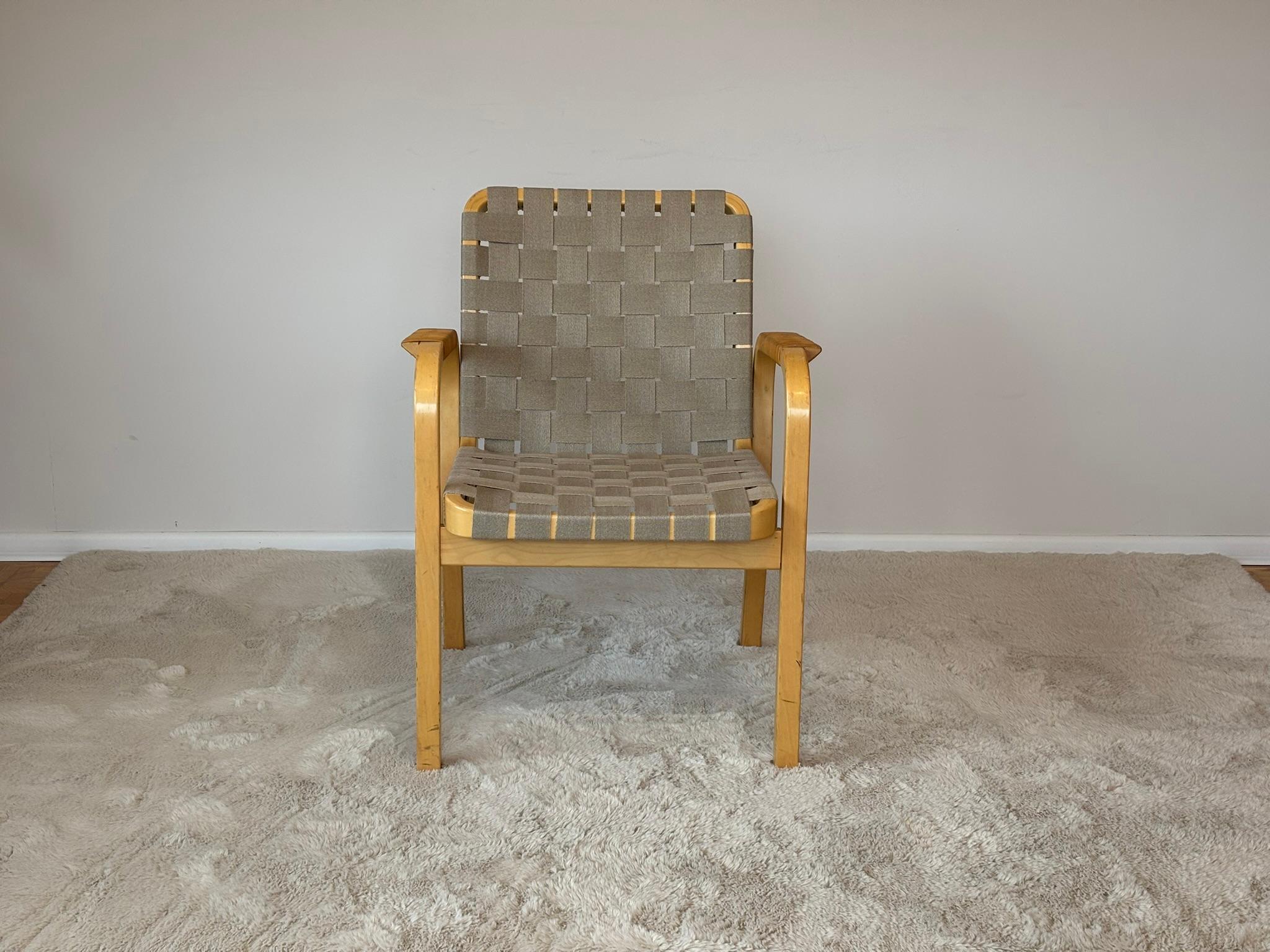 Model 45 Chair by Alvar Aalto for Artek, 1970s
Beautiful vintage armchair designed by Alvar Aalto for Artek in the 1970s. This version features a solid birch frame with light linen webbing and rattan details, showcasing Aalto’s signature organic