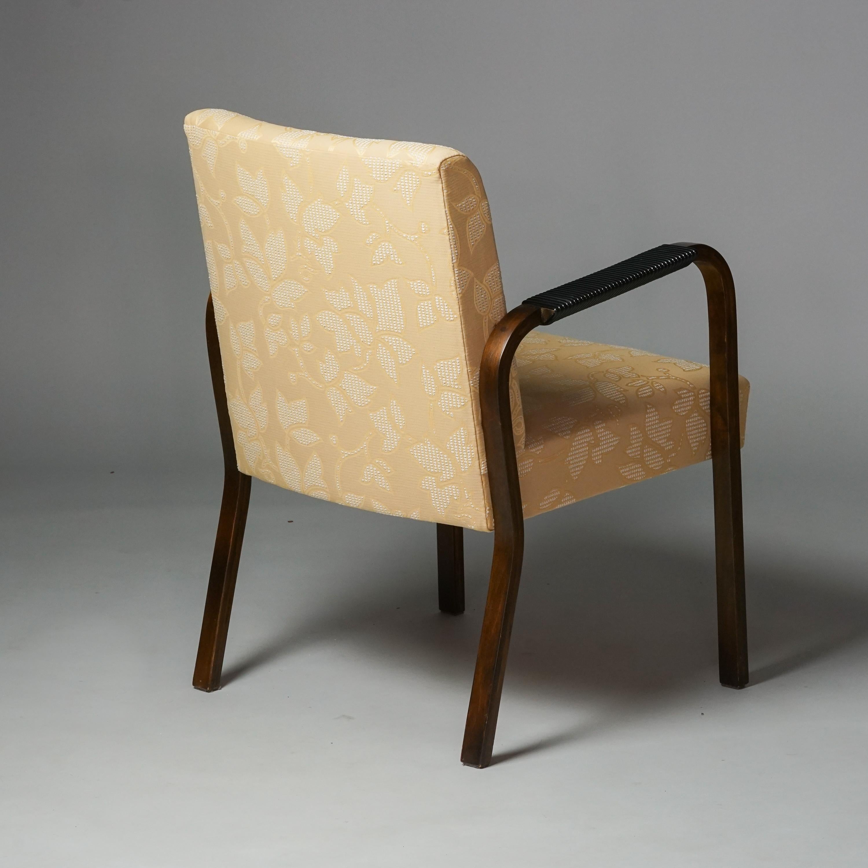 Model 46 armchair, designed by Alvar Aalto, 1930/1940s. Stained birch frame with kerni wrapped handles. Later reupholstered with quality fabric. Good vintage condition, minor patina consistent with age and use. 

Alvar Aalto (1898-1976) is probably