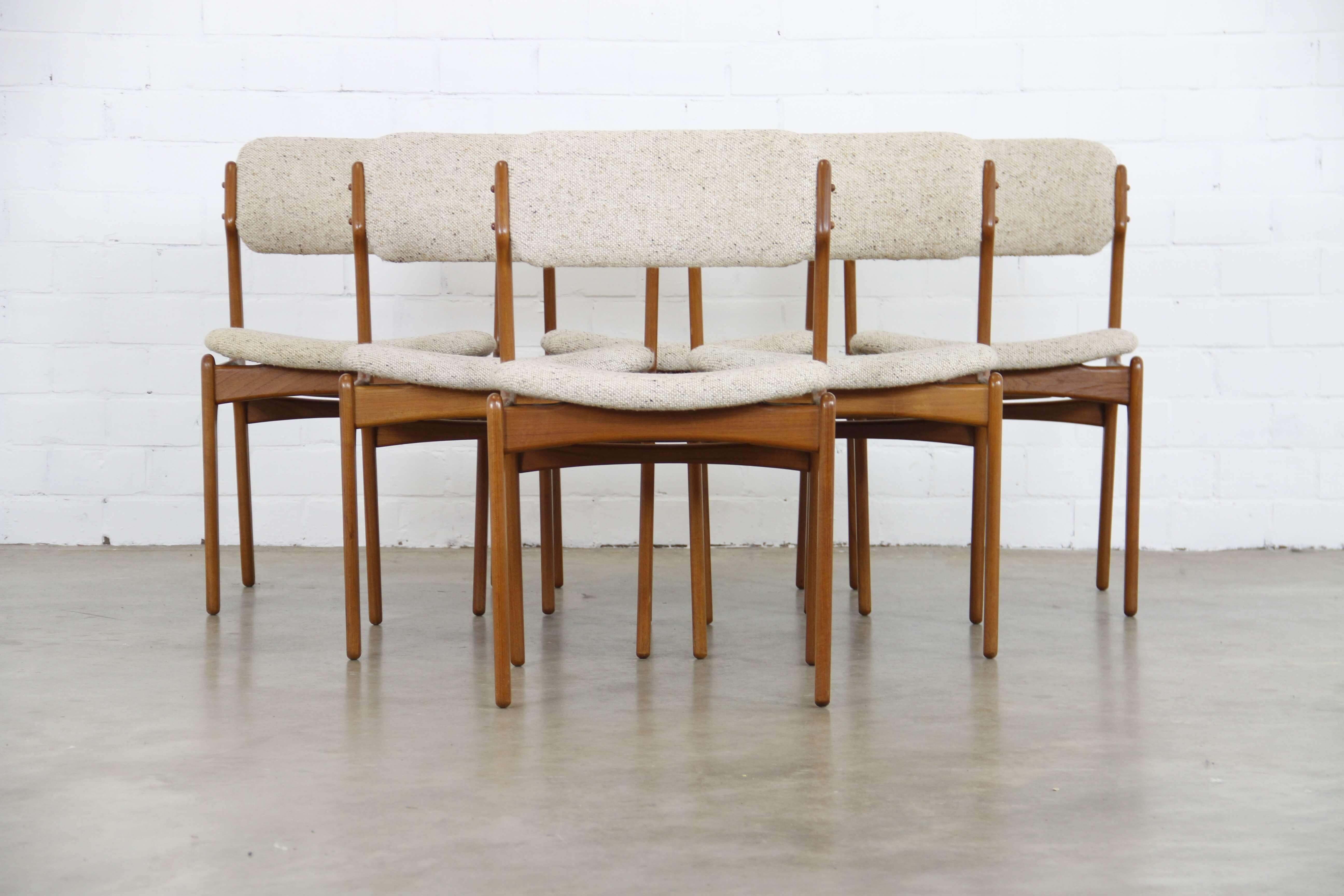 This set of 6 model 49 chairs was designed by Erik Buch for OD Mobler in Denmark. The set is finished in teak and retains its original wool upholstery.
 