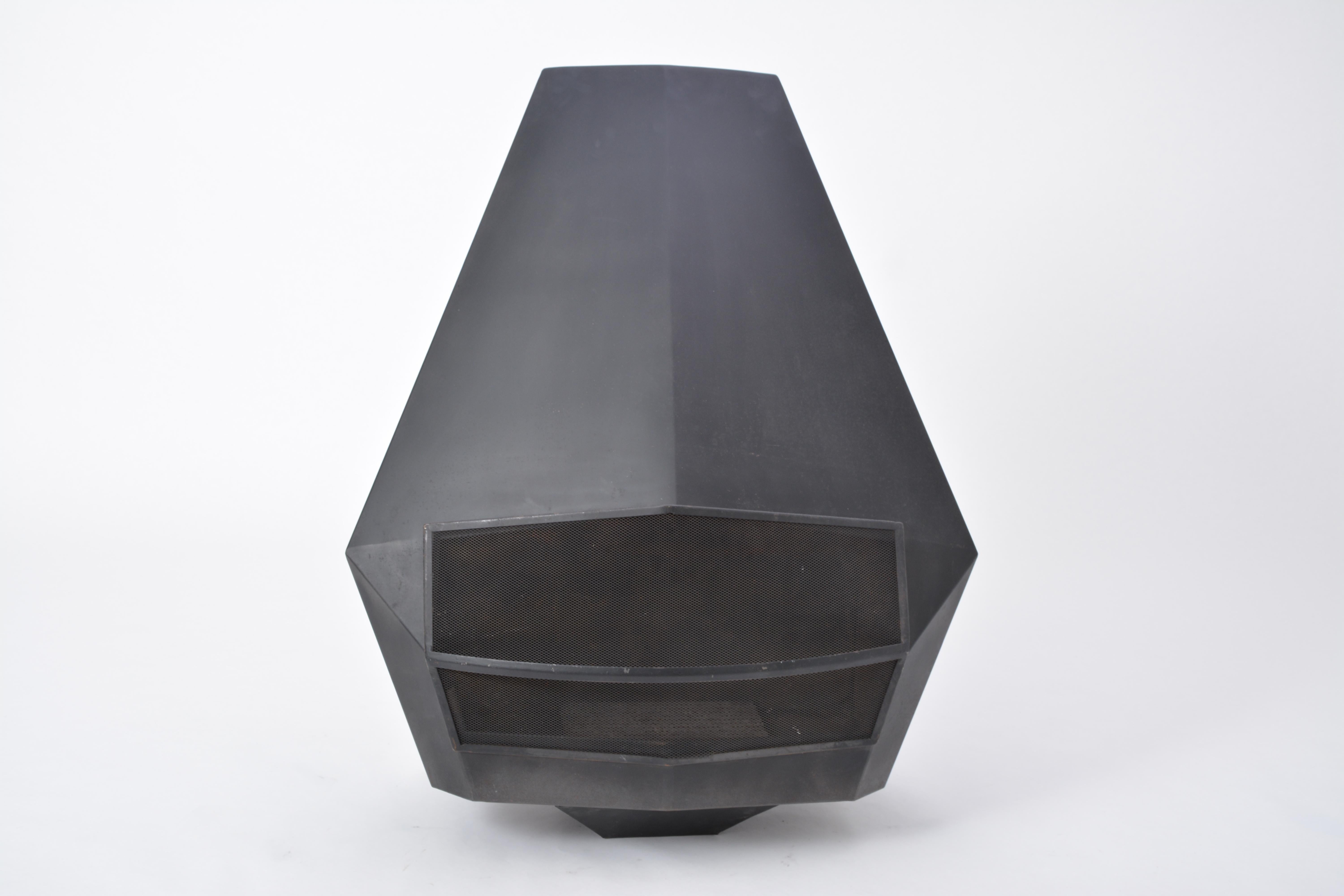 Model 5005 Mid-Century Modern Steel fireplace from Don-Bar Design

A Model 5005 wall-mounted robust fireplace in black coated steel produced by Belgian company Don-Bar Design in the 1970s.
Comes with ash pan, metal suspension handles, grill, fire