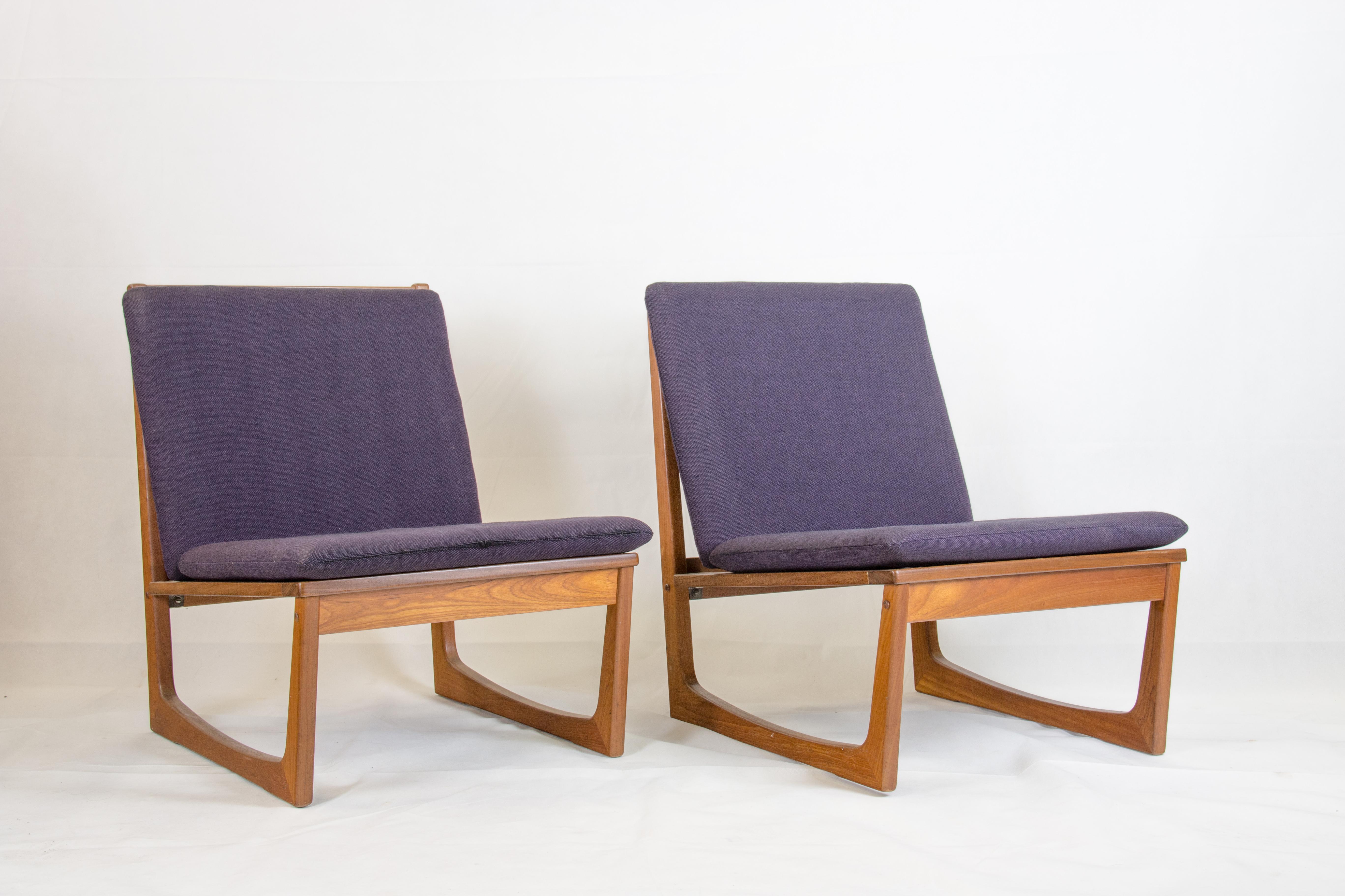 Pair of teak easy chairs designed by Hans Olsen
and manufactured by Brdr. Juul Kristensen
original purple wool cushions probably by Kvadrat