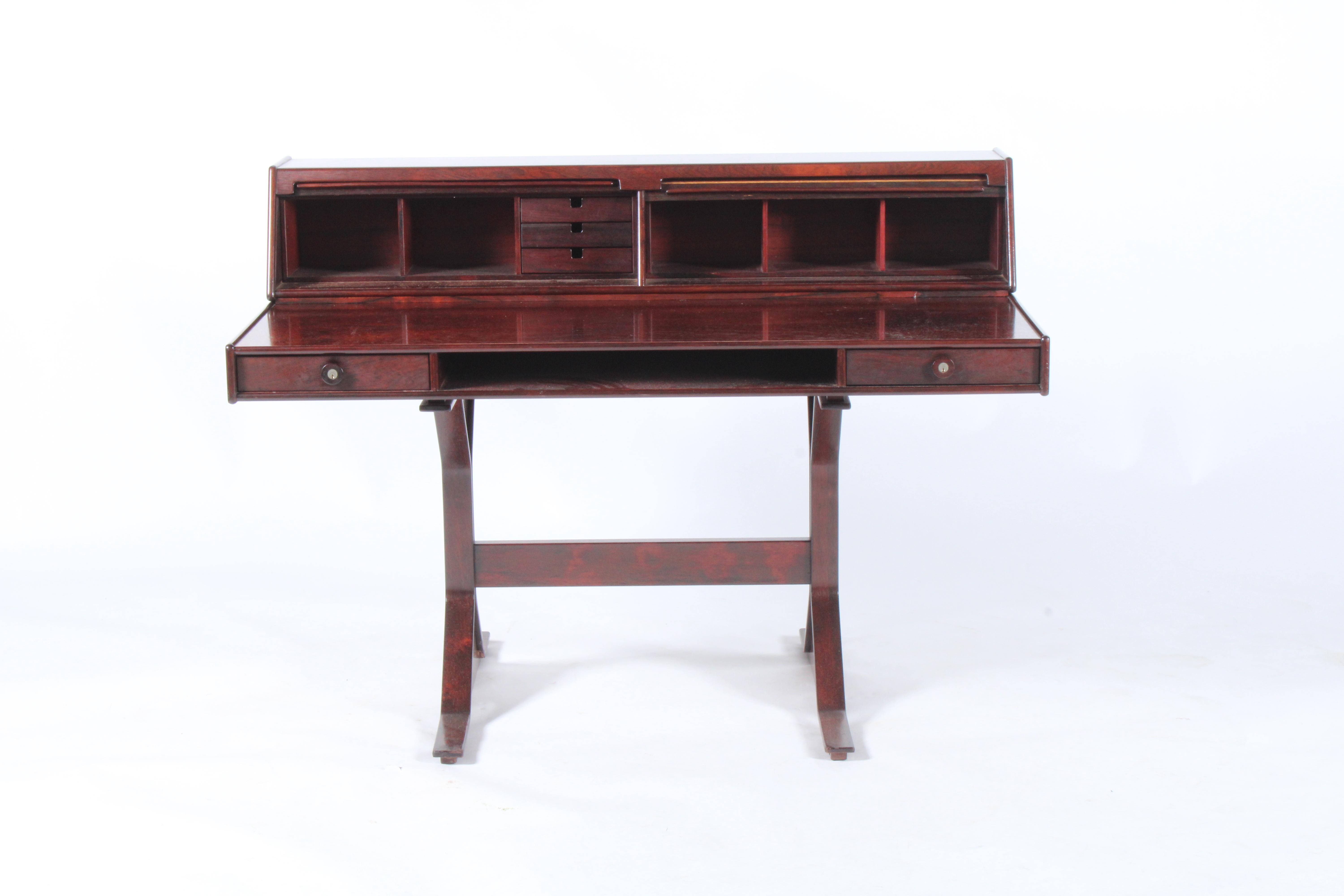 Stunning design and real quality make this desk one of the stand out pieces for sale in our collection. Originally designed in 1957 by iconic Italian designer Gianfranco Frattini, this is a later production by Bernini circa 1962.With tambour doors